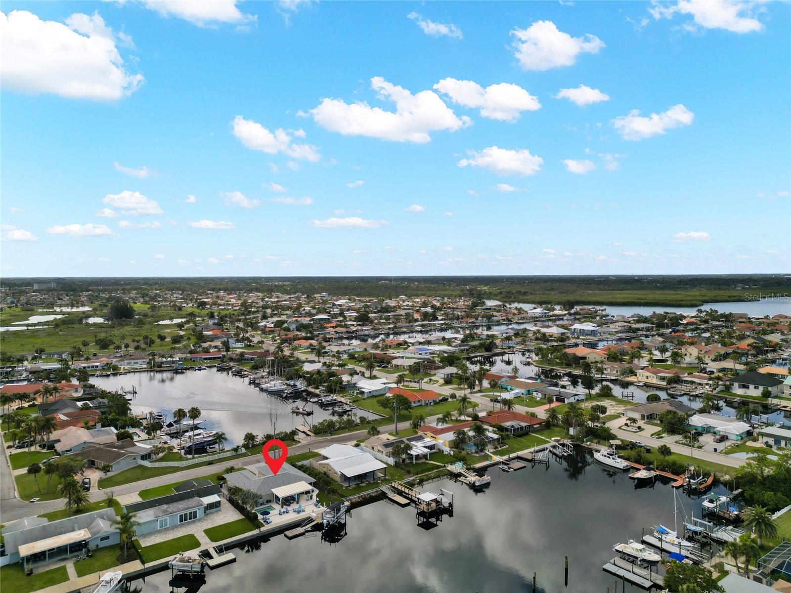 WATER VIEW FROM BOTH SIDES OF THE HOME.  FRONT OF HOME WATCH SUNRISE OVER CHANNEL WATER. BACK SIDE WATCH SUNSET OVER THE GULF WATER.  AMAZING LOCATION.  RARE FIND