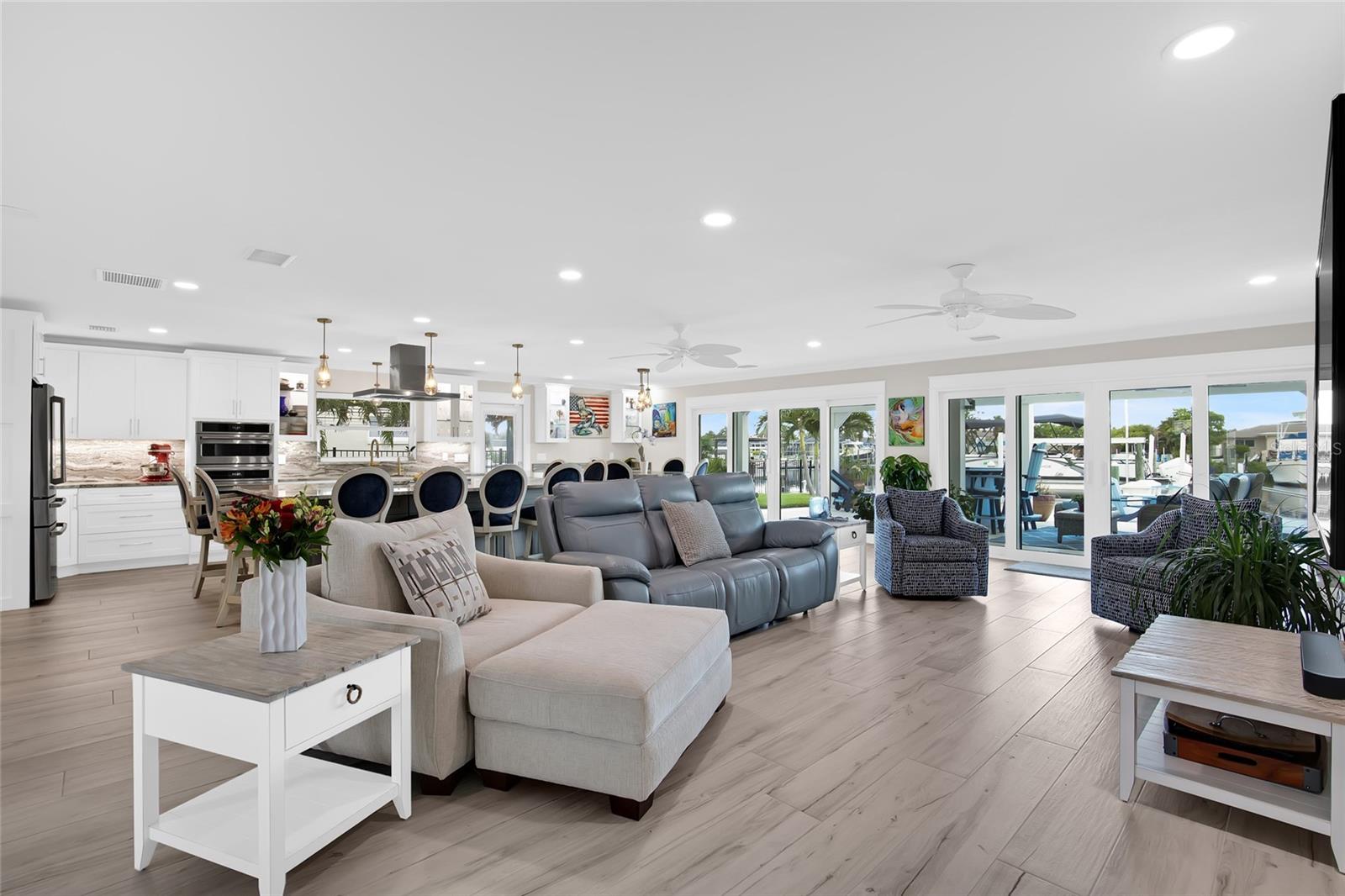 GRAND GREAT ROOM IDEAL FOR ENTERTAINING - LEADS TO THE DOUBLE ENTRY BACK YARD SPACES.  MULTIPLE SPACES IN THE BACK YARD FOR ENTERTAINING AND ENJOYING - SUNSET VIEW FROM FRONT DOOR