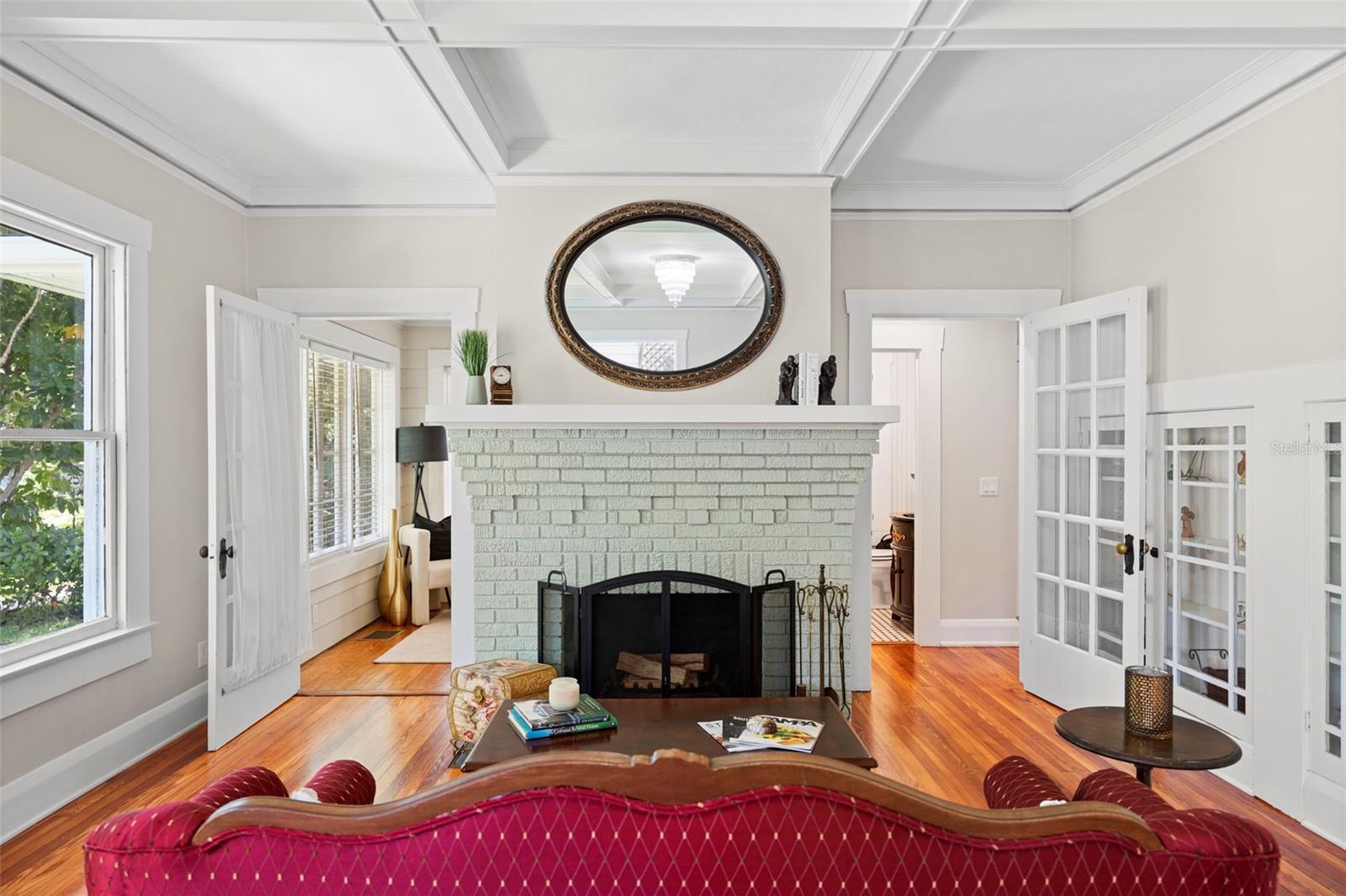 Formal sitting room with wood burning fireplace
