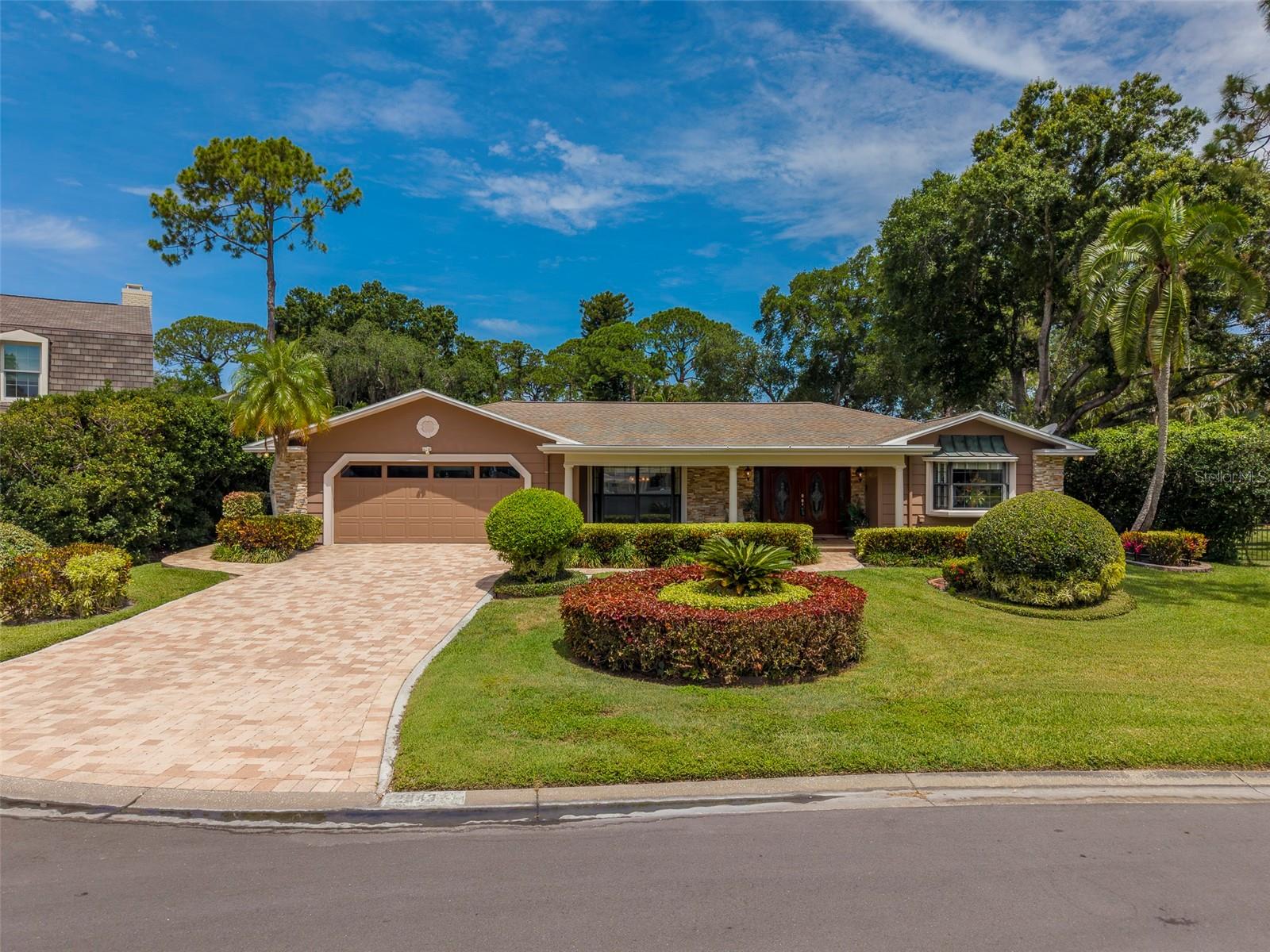 Front of Home, Beautiful manicured lawn and paver driveway situated on a cul-de-sac.