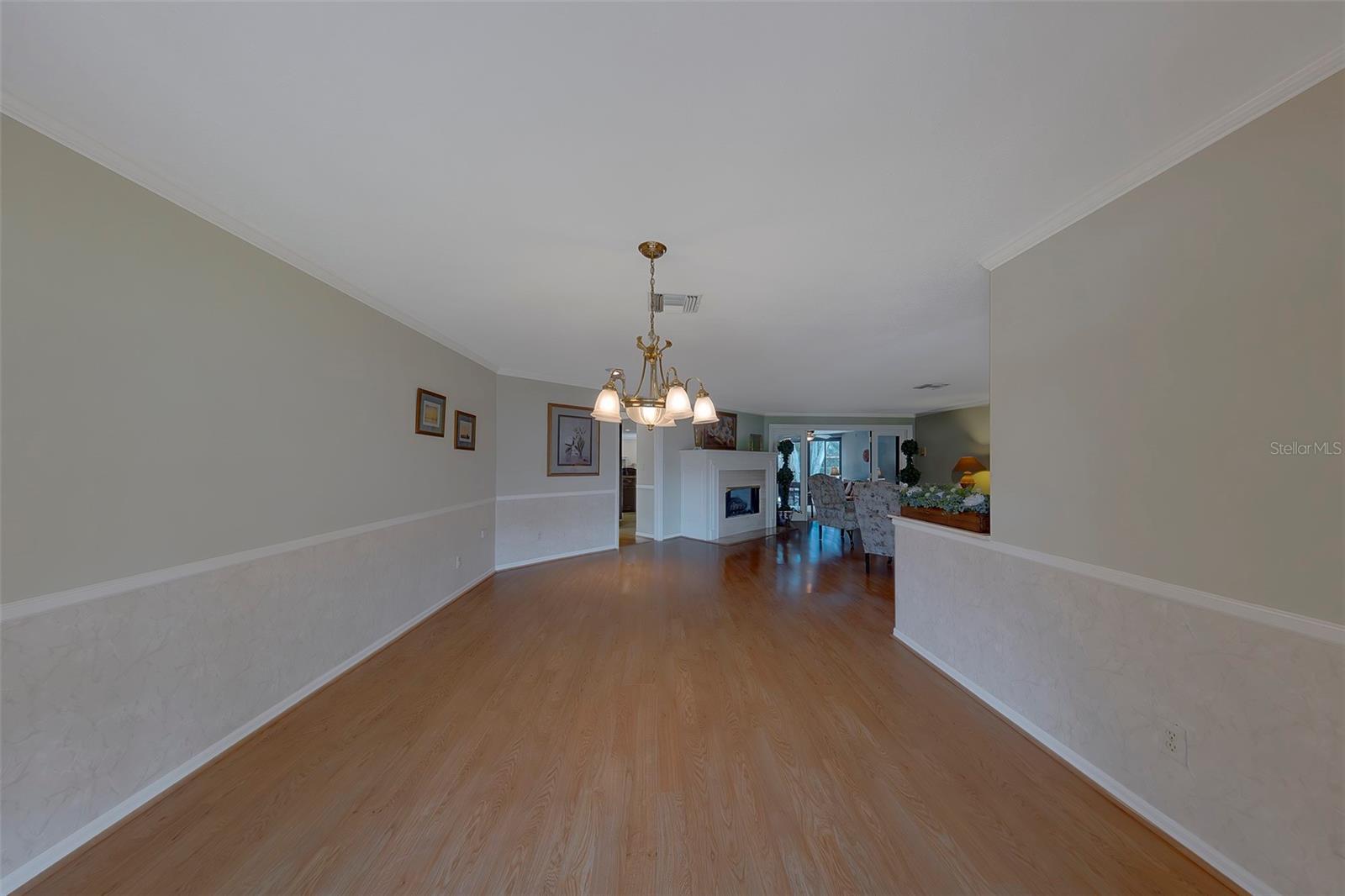 Reverse view of the formal dining leading into the formal living room