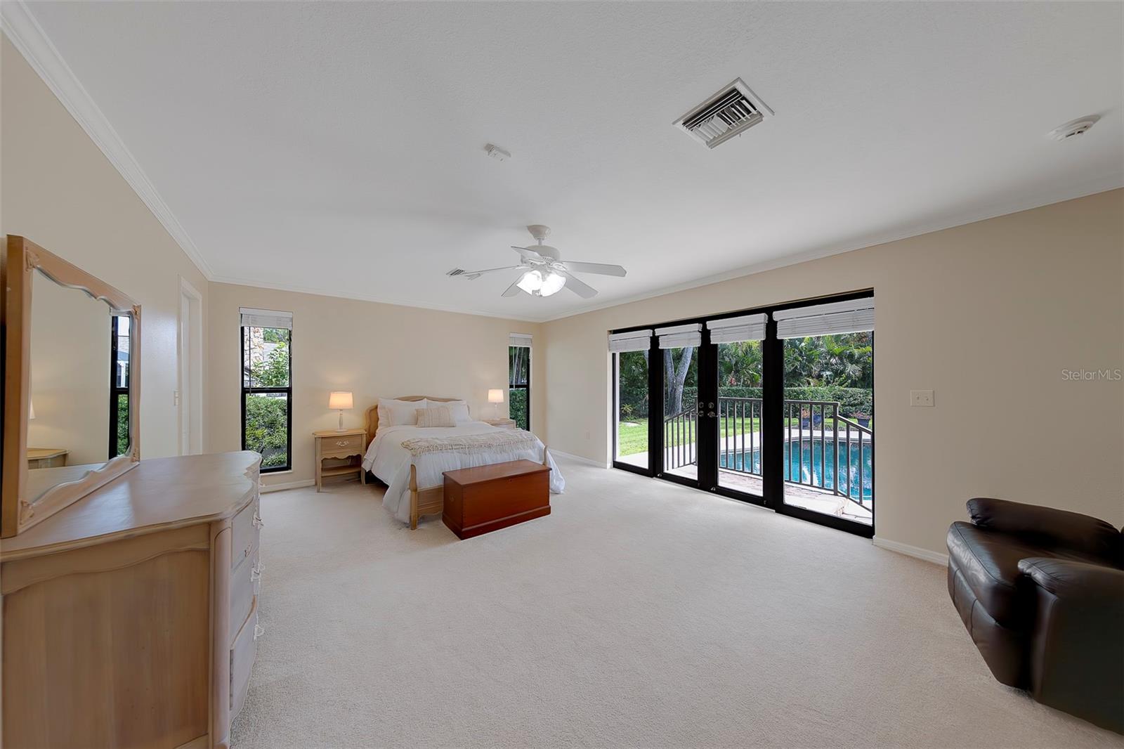 Bedroom 4 is another large master with walk in closet overlooking the pool