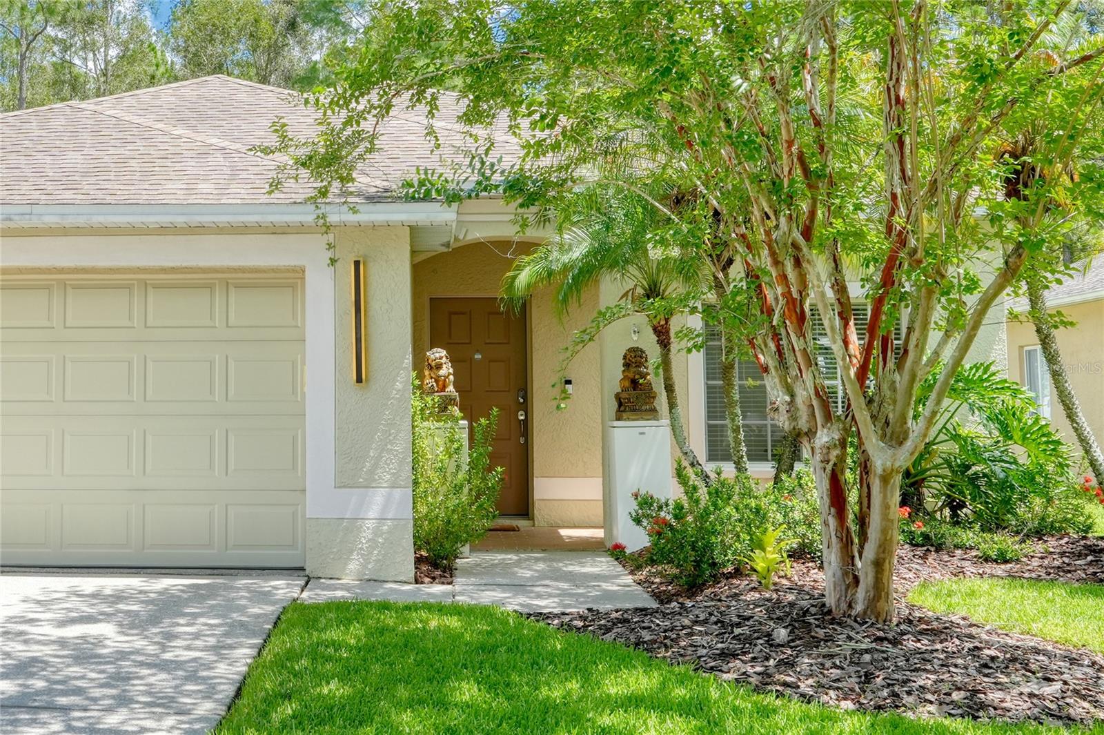 Mature landscaping with fruit trees and lush surroundings