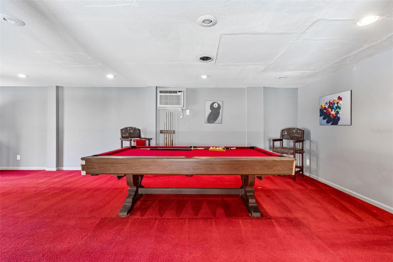 More fun space. Newer carpet. Recessed lights.