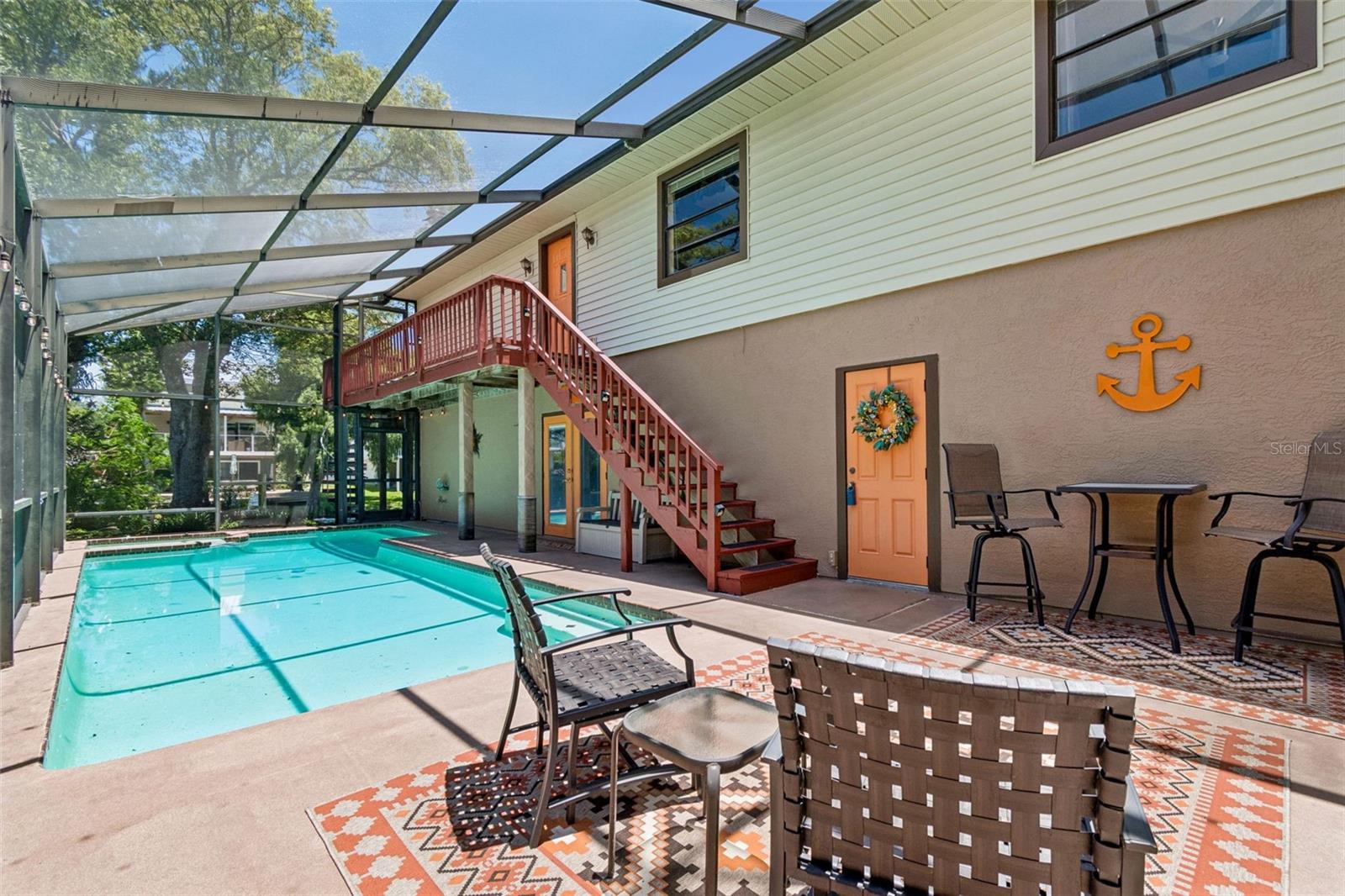Fully screened pool and spa area. Access to downstairs bonus room, upstairs living area and garage.