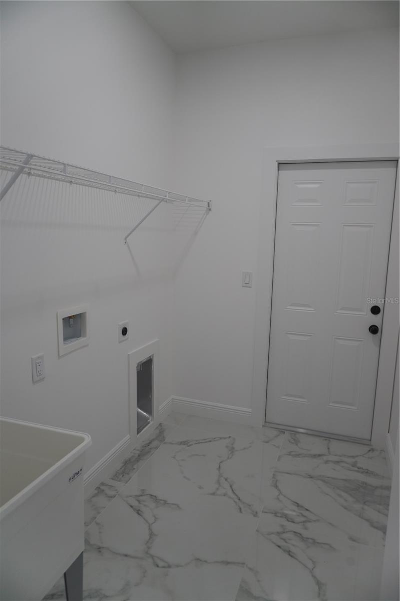 Laundry room with sink