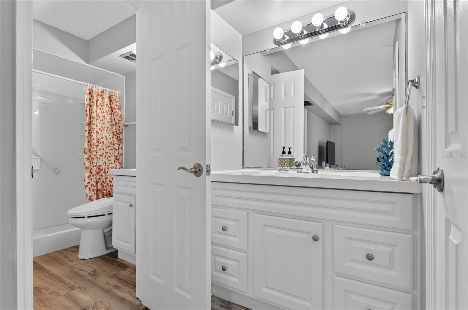 Bathroom is in the hallway with an additional vanity in the Primary Bathroom.