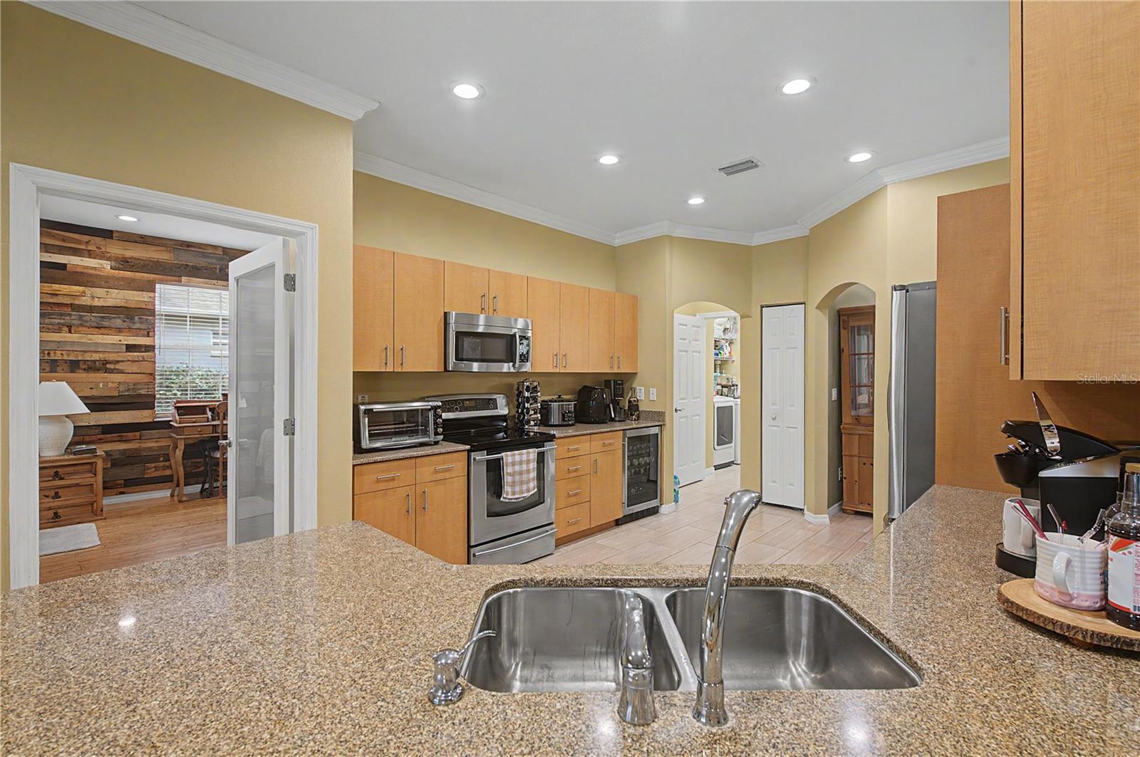 Granite Countertops, Crown molding, Stainless Steel Appliances and tile flooring.