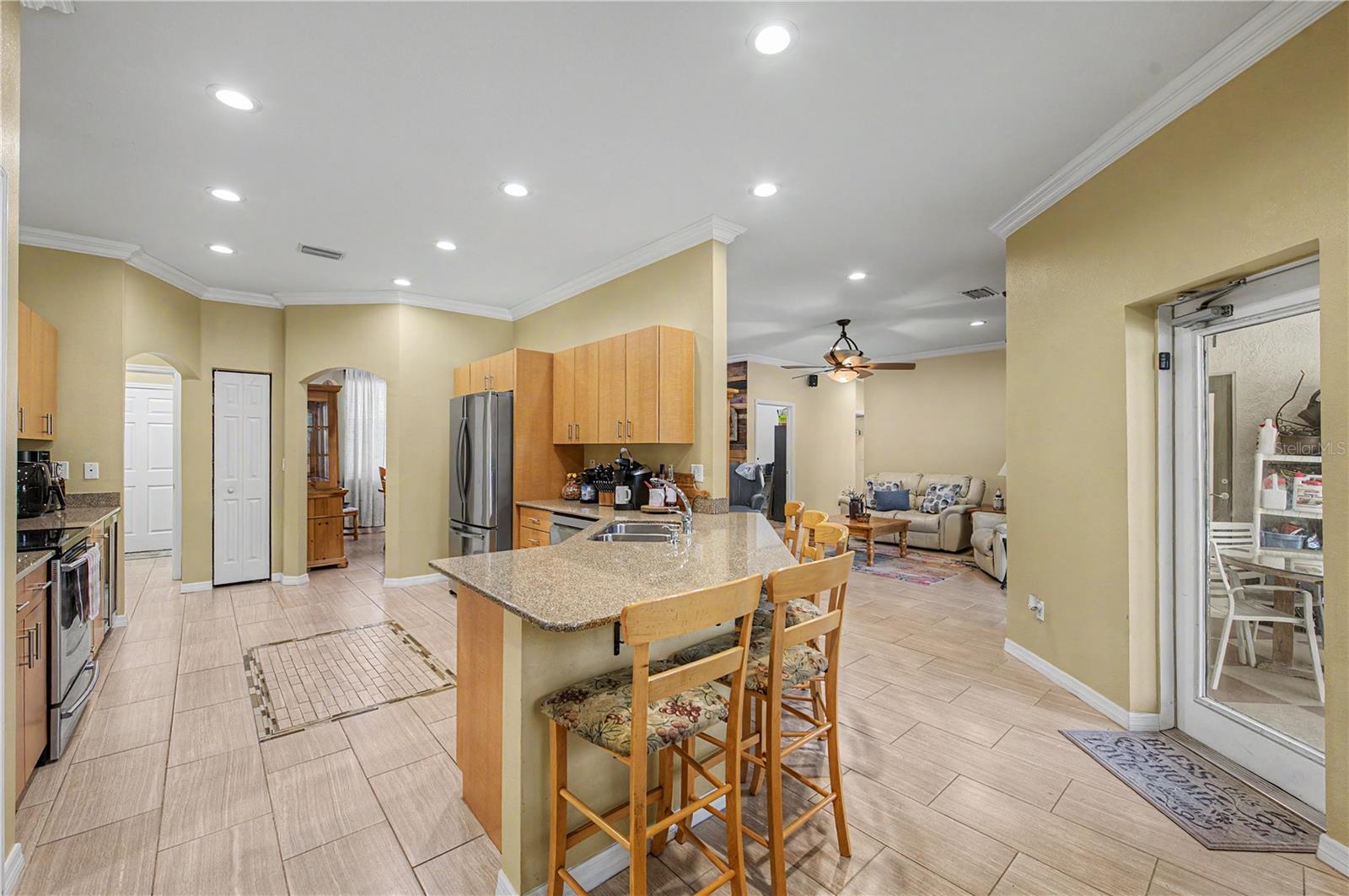 Granite Countertops, Crown molding, Stainless Steel Appliances and tile flooring.