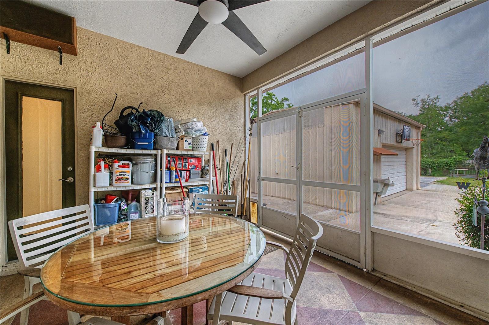 Rear covered patio with fan.