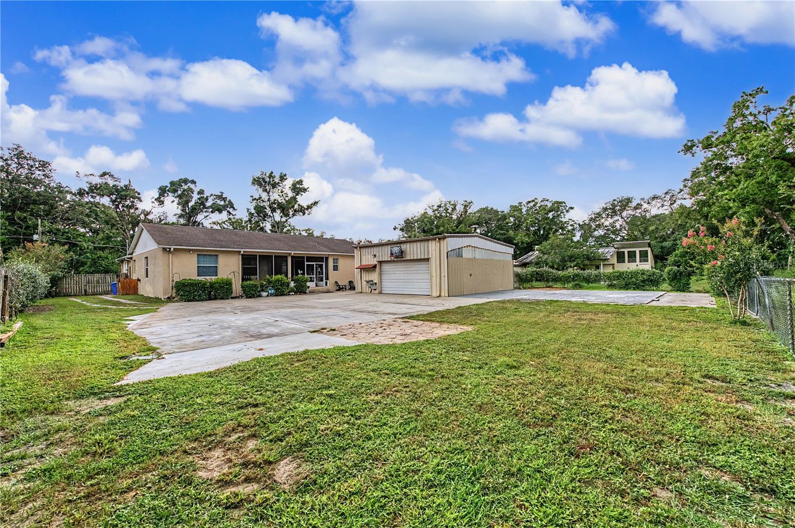 Almost an acre of privacy, large workshop/garage behind the home.