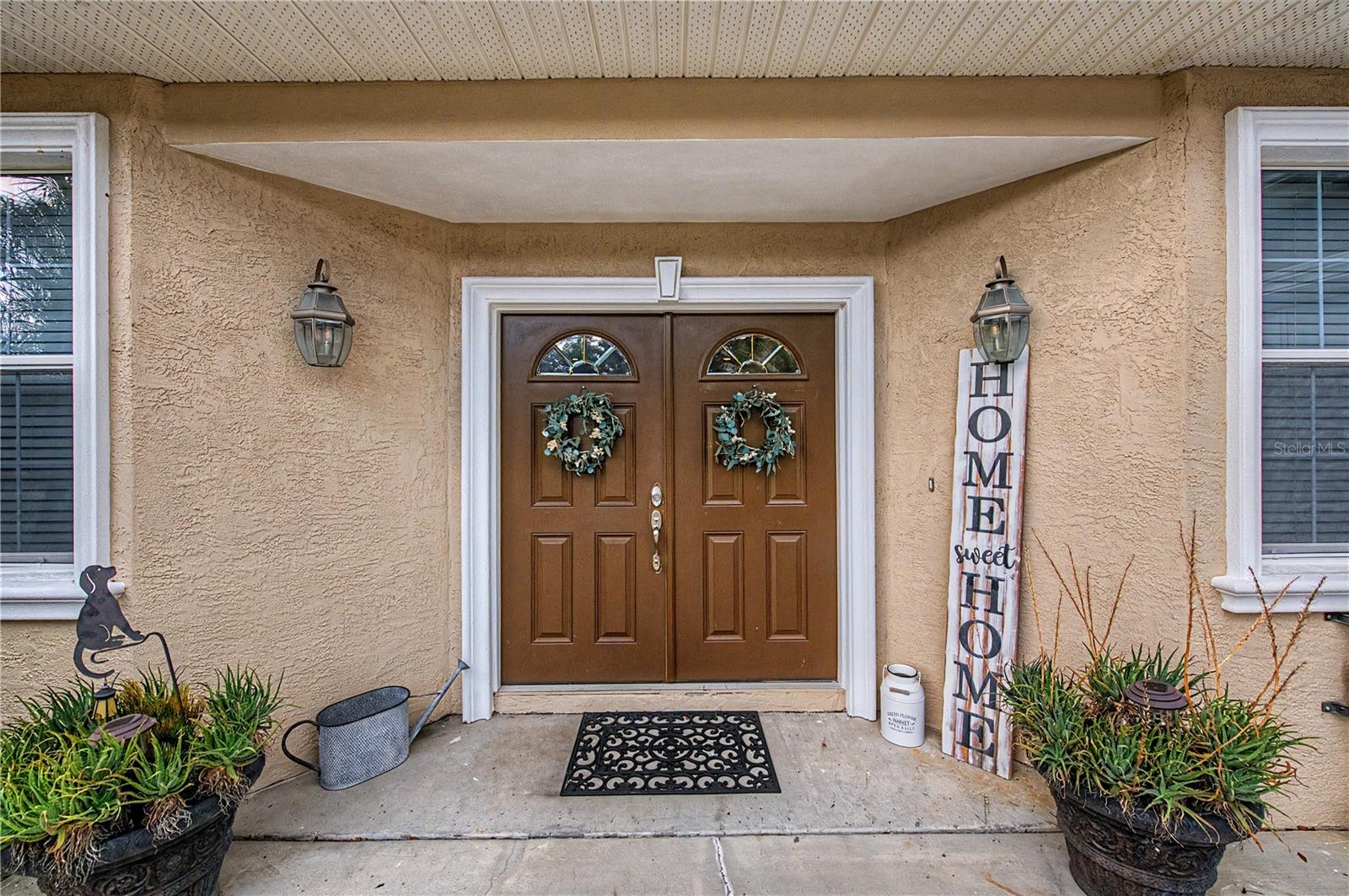 Double Front Doors, almost an acre of land -  very private, no HOA or CDD fees.