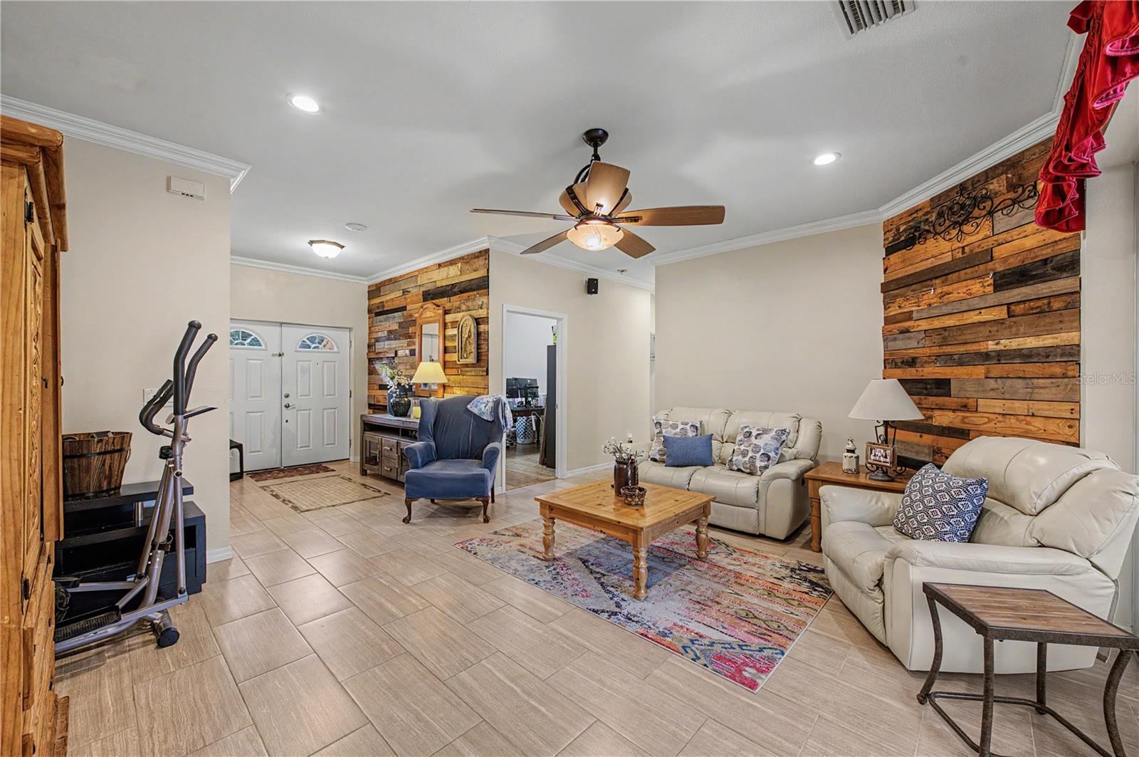 Family Room, tile flooring and ceiling fan, inset lights.
