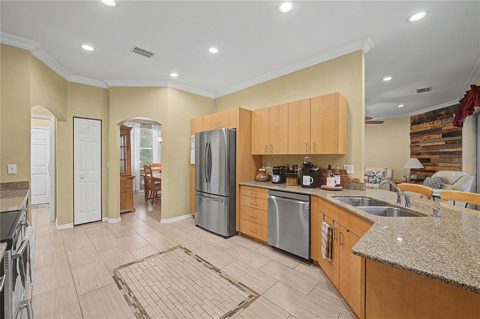 Granite Countertops, Crown molding, Stainless Steel Appliances and tile flooring.