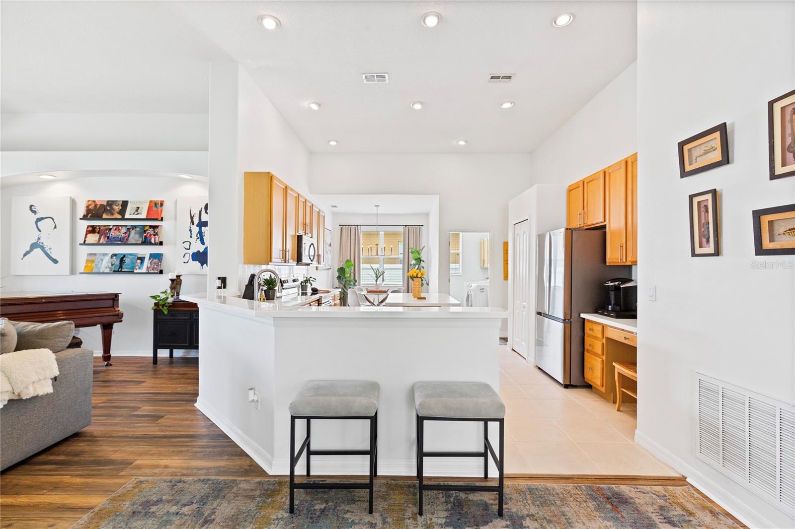 Kitchen has large breakfast bar for plenty of seating.