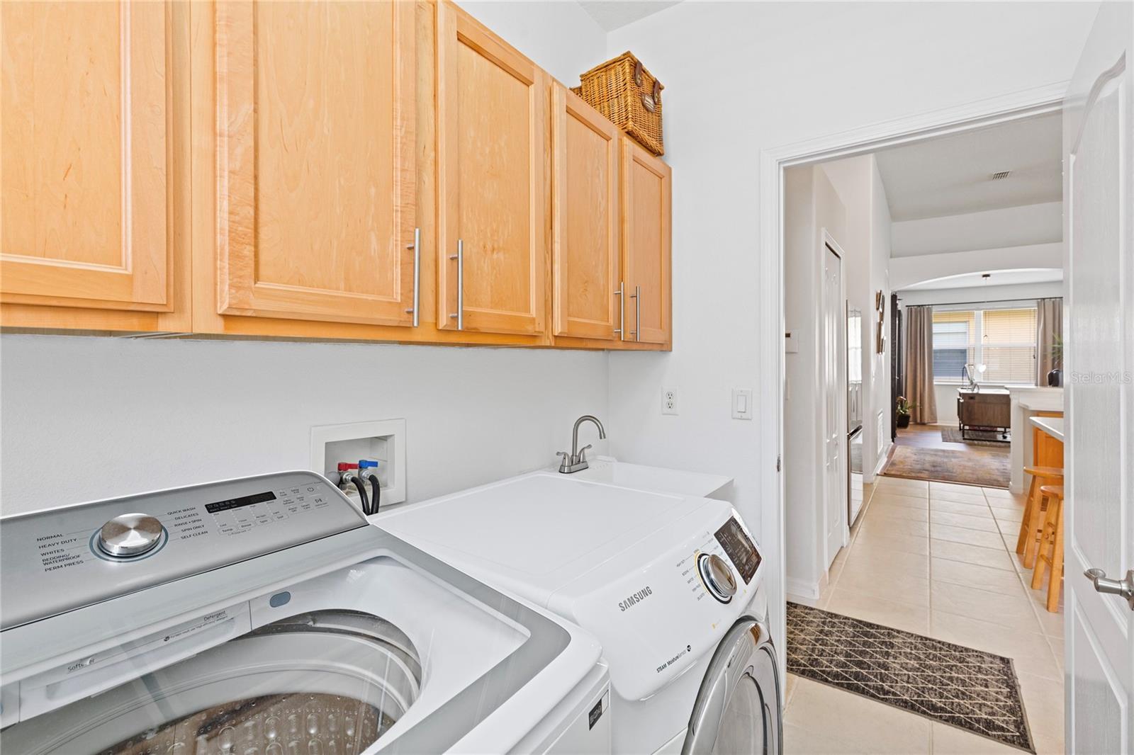 Laundry Room has bright  and airy feeling making laundry day a breeze.