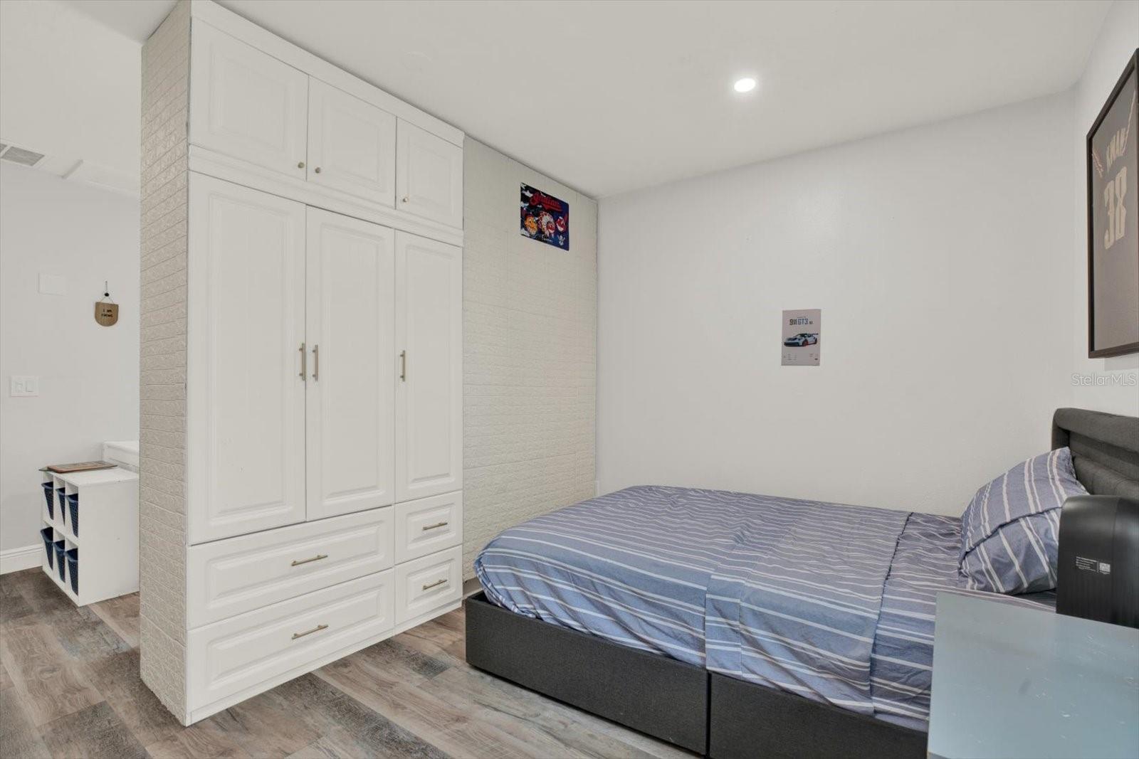3rd bedroom storage closet system can be moved back to a wall for one large bedroom