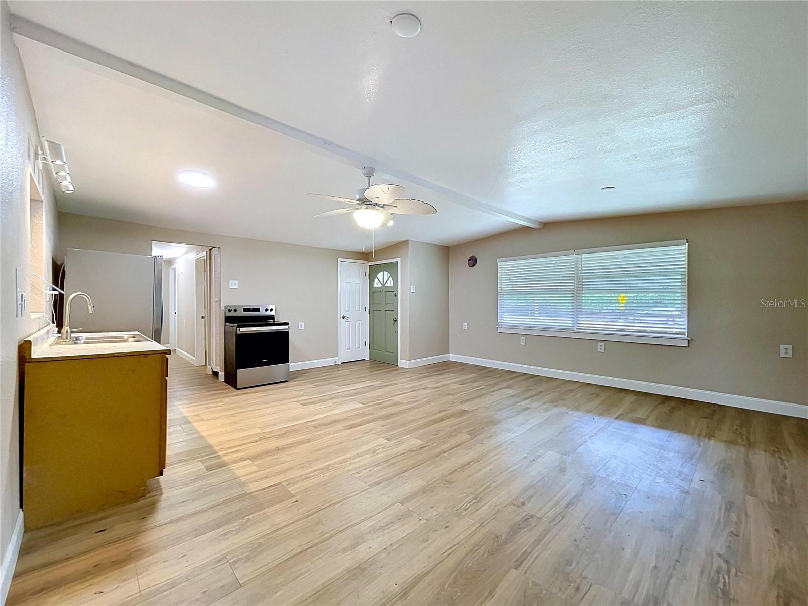 ENTRY, LIVING AREA AND KITCHEN