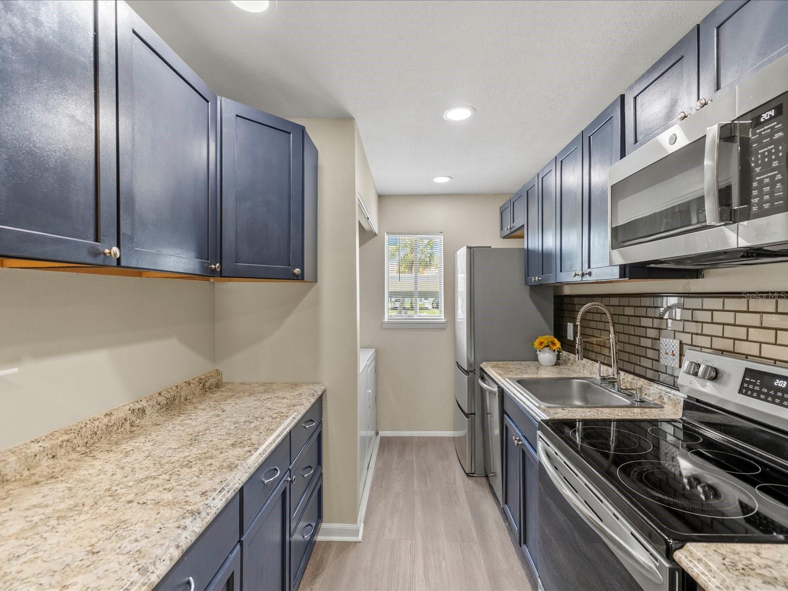 Galley kitchen with laundry