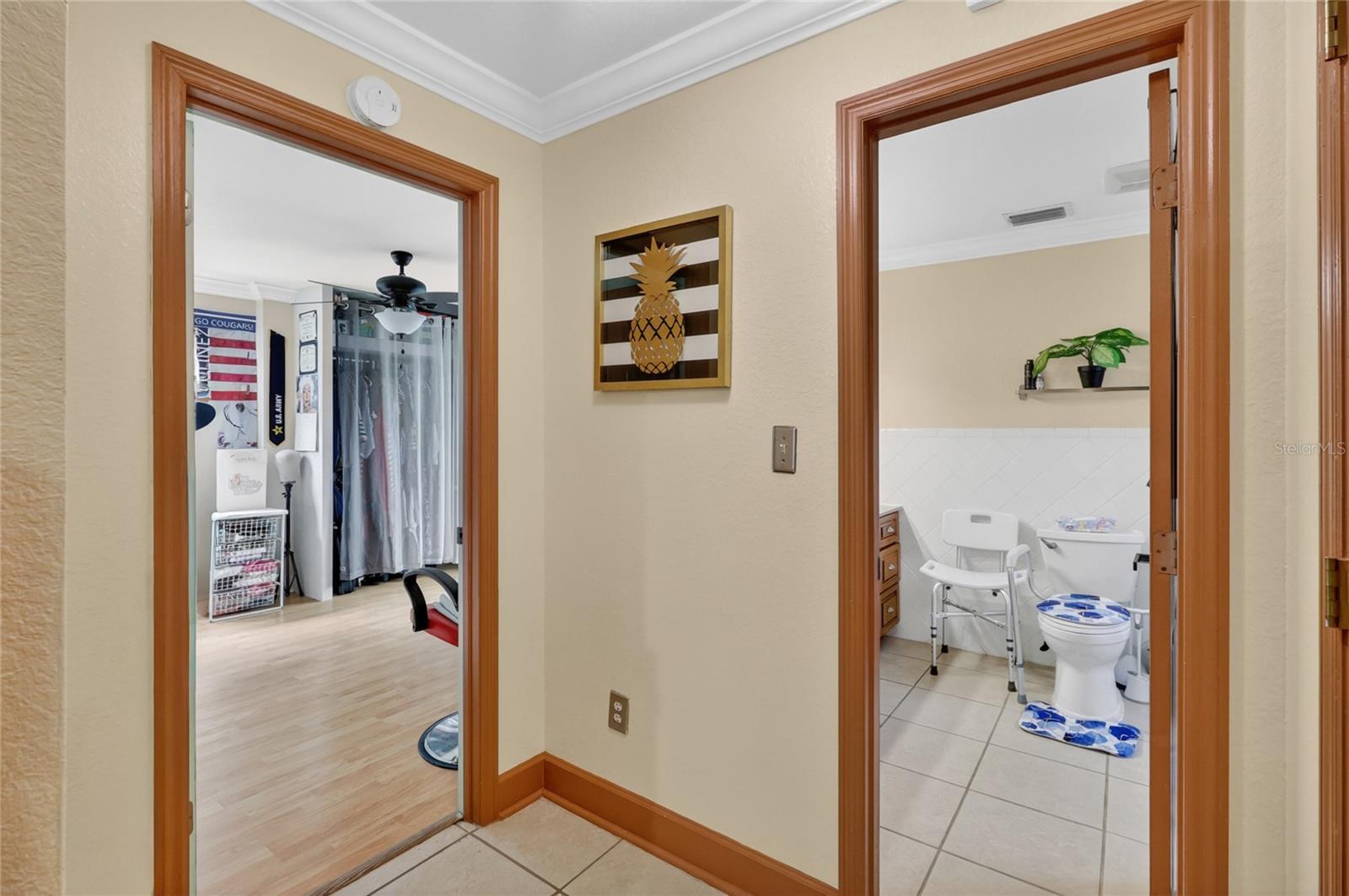 Main floor space offers a bedroom or office space and large open bathroom.
