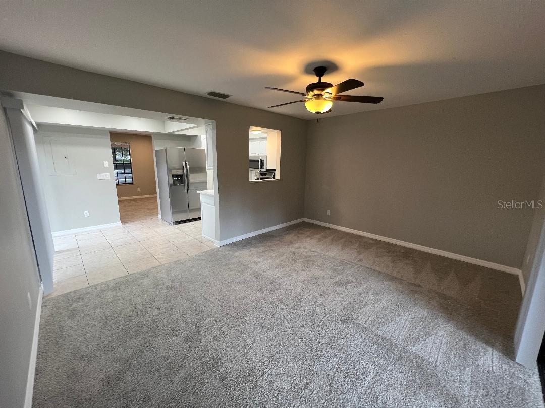 Family room view to dining room , kitchen and living room.