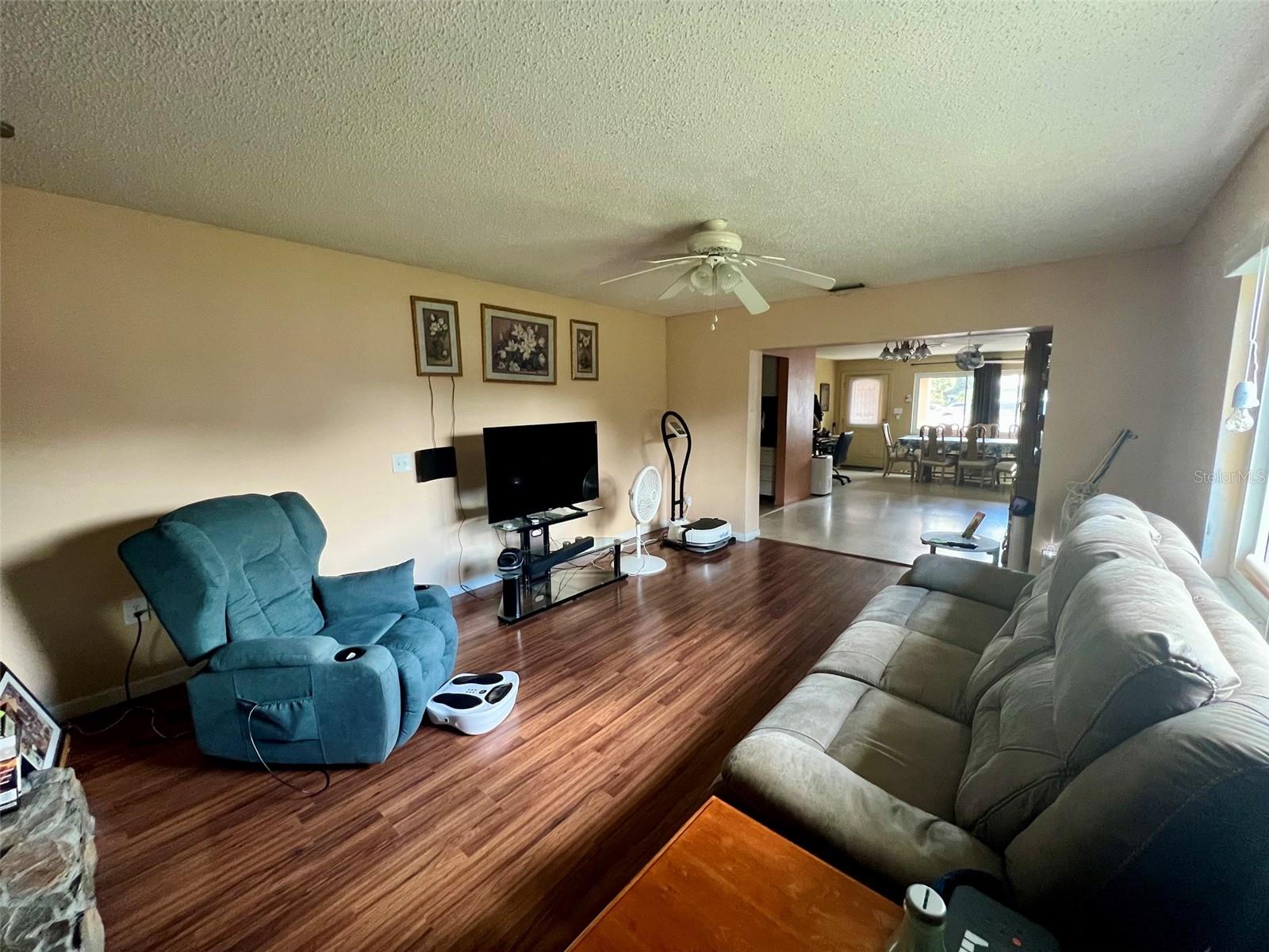 The family room fully equipped with a wood burning fireplace