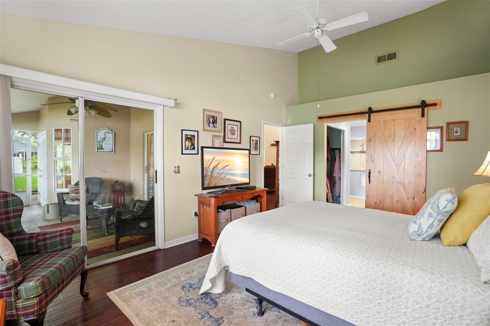 Primary bedroom with barn door to the ensuite