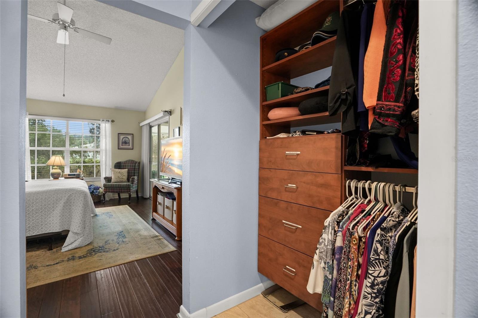 Closet with built ins towards the primary suite