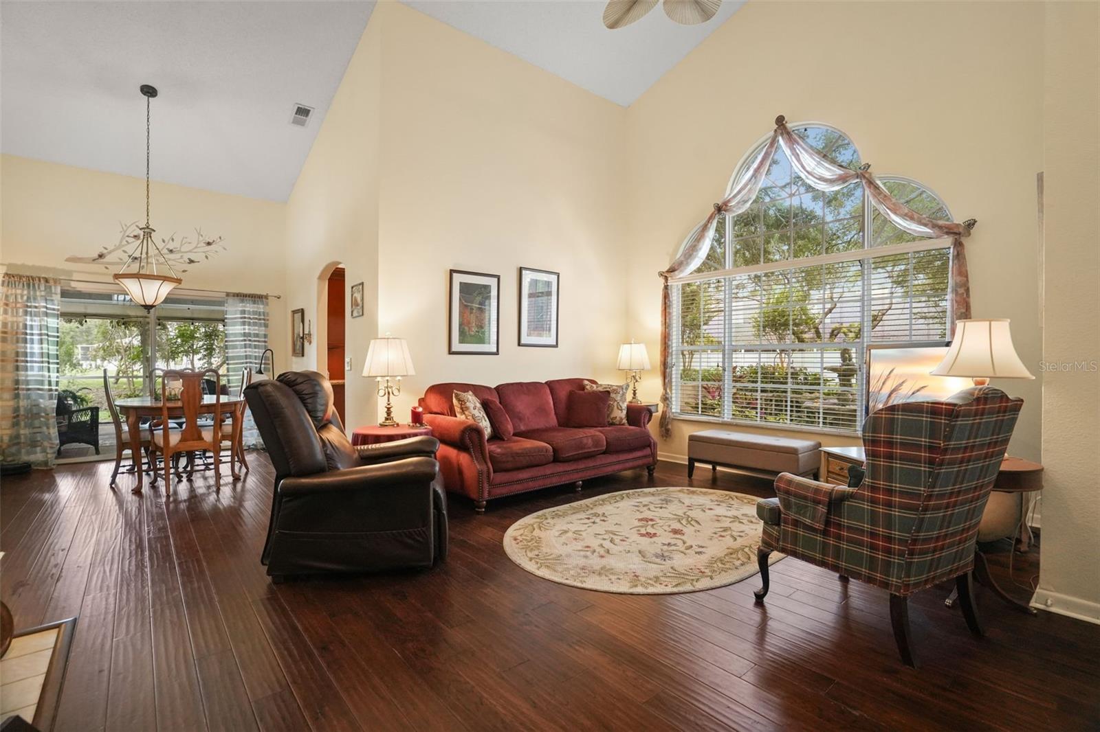 Large family room with a wall of windows for tons of natural light