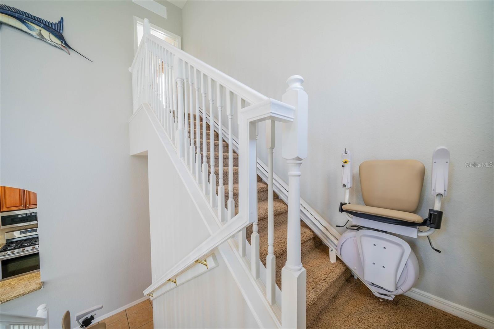 Stairs to bonus room with chairlift.