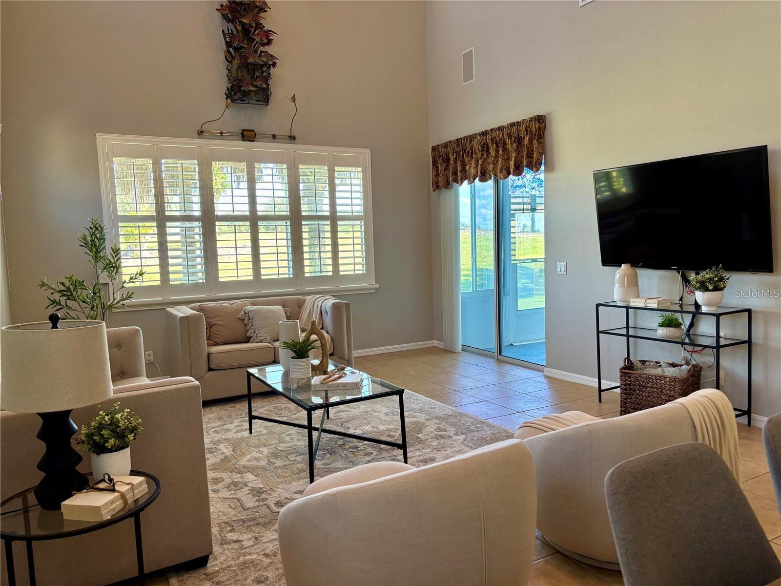 View of living room and sliding doors into lanai