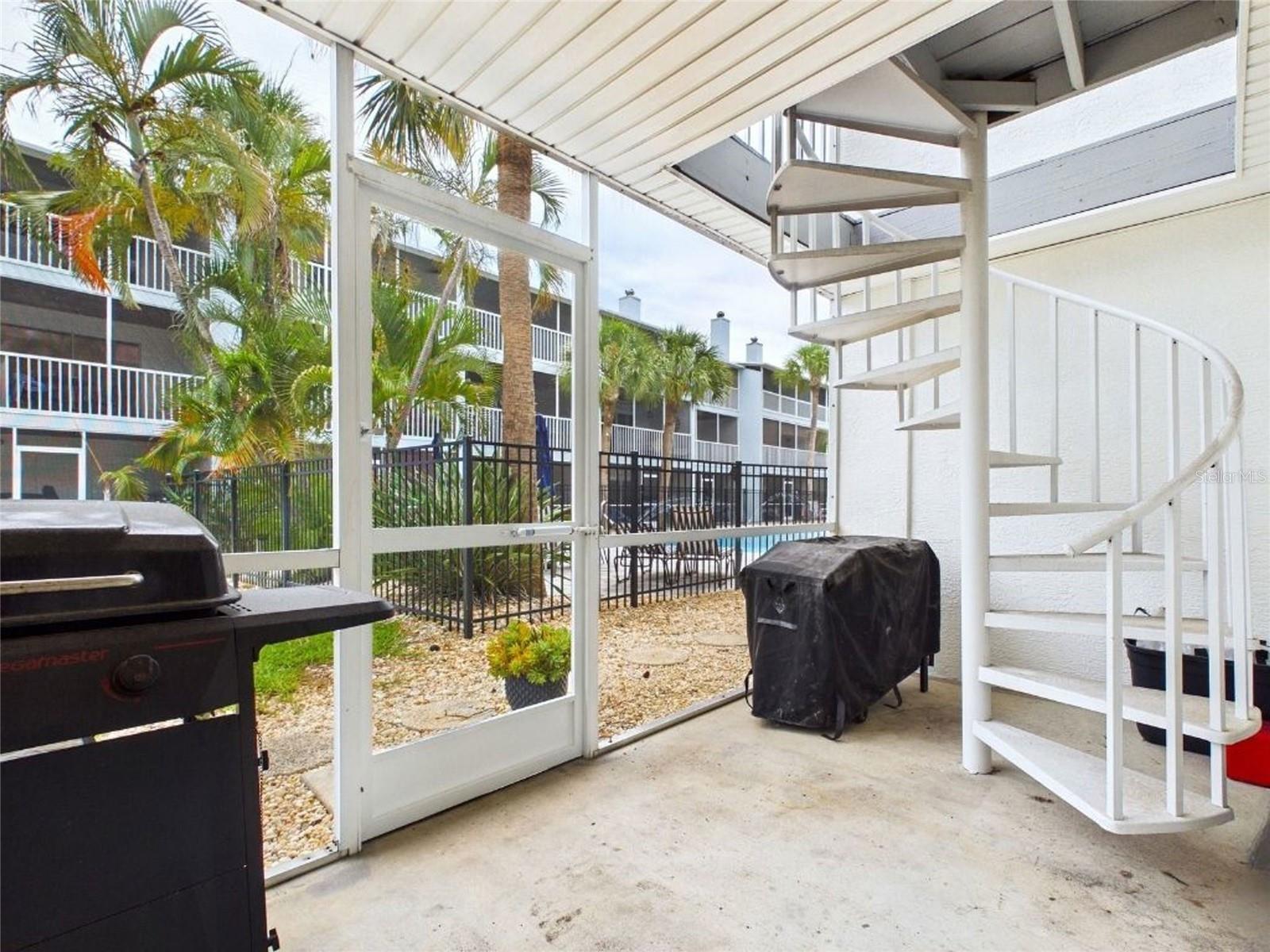 Ground patio perfect for grill and pool access