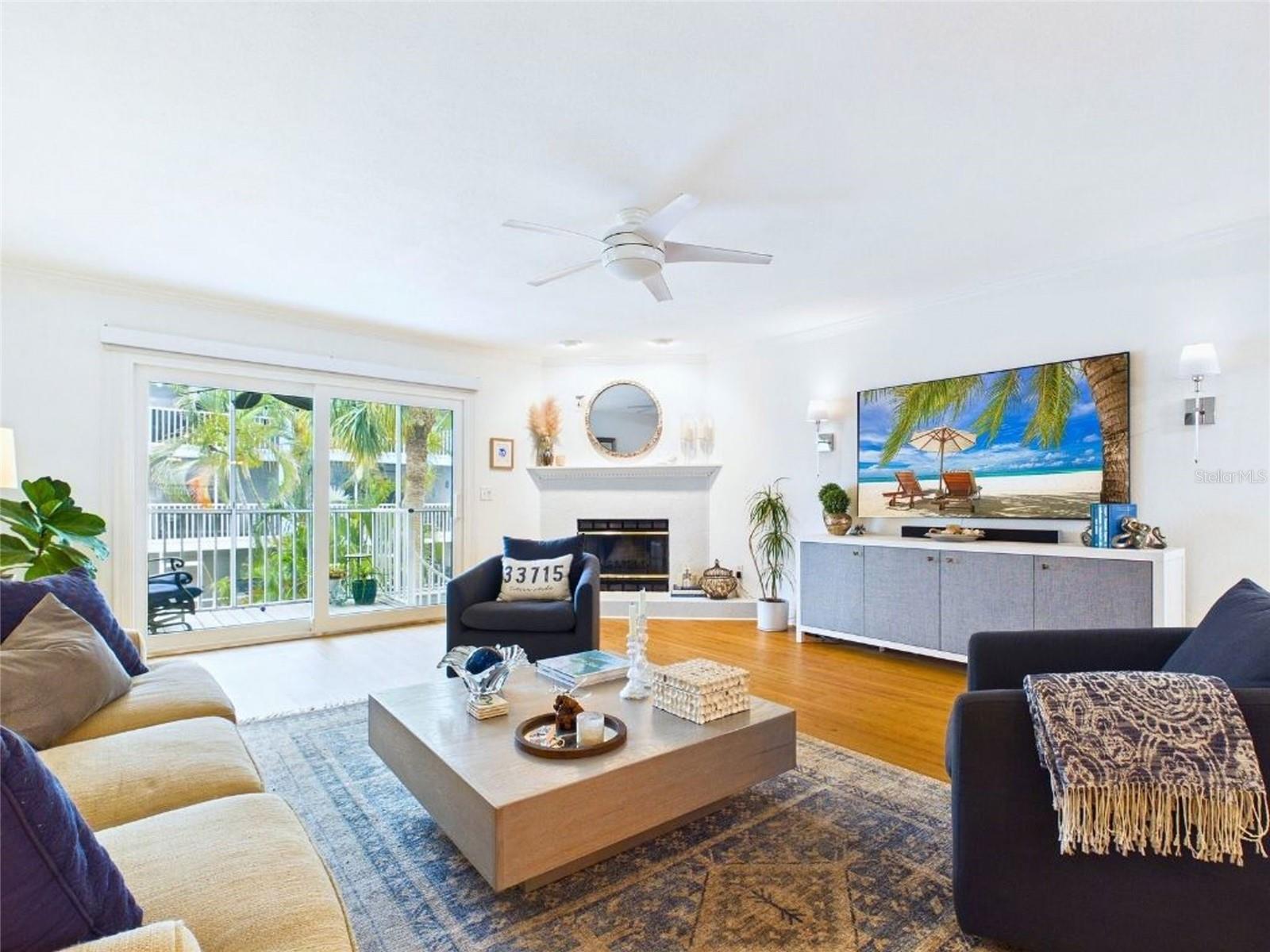 Living Room with Balcony and Pool View