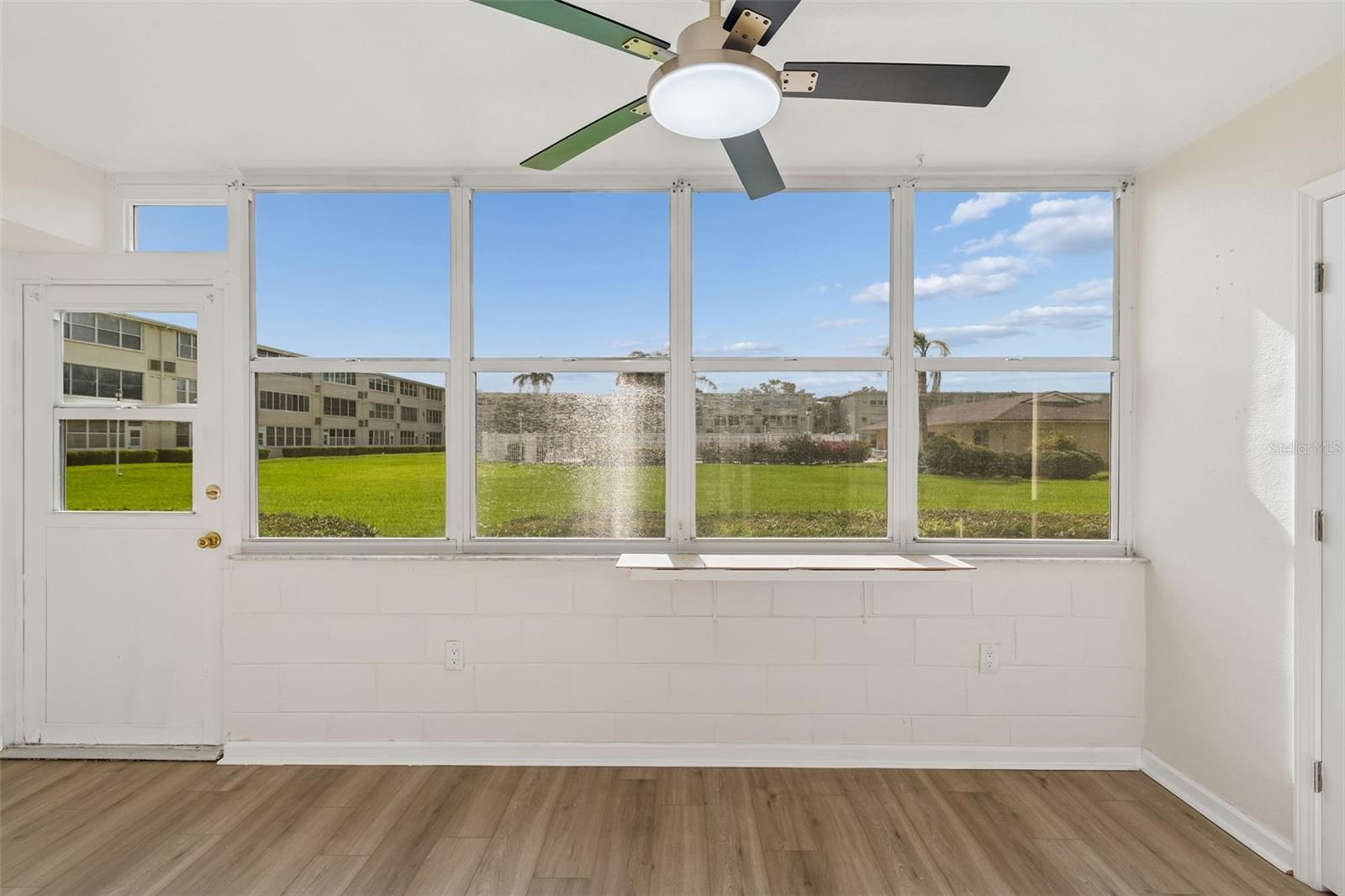 Florida room with view of Courtyard and Pool