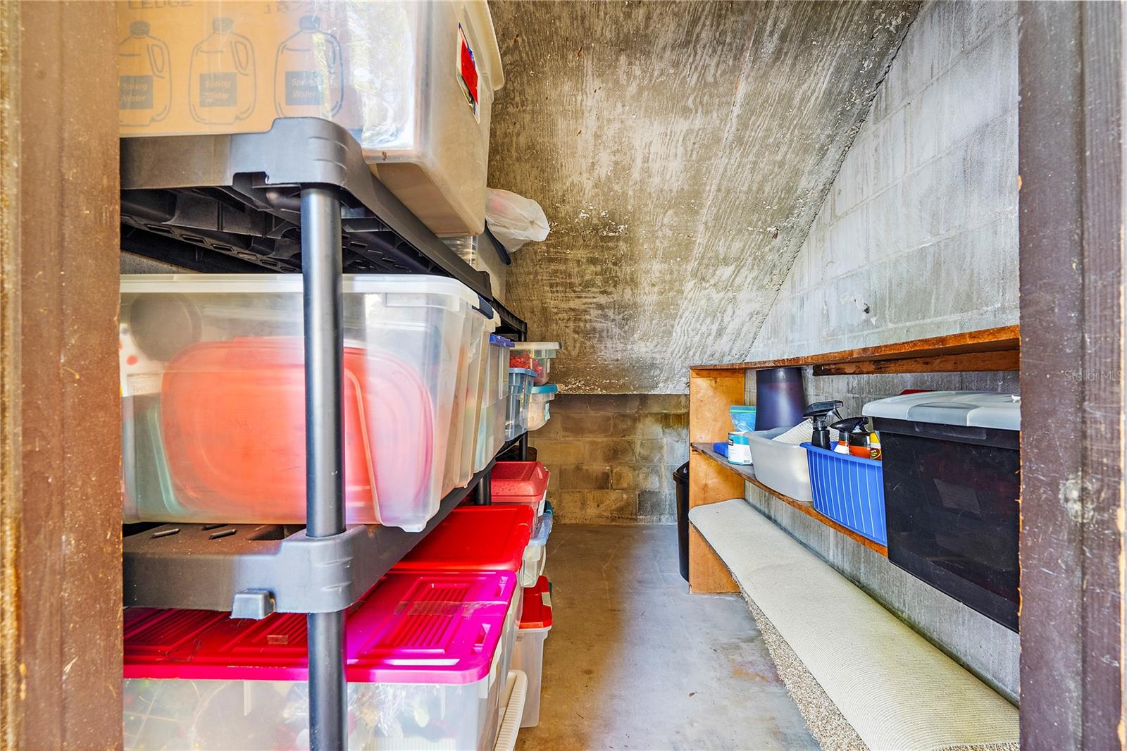 Private locked storage under south stairs