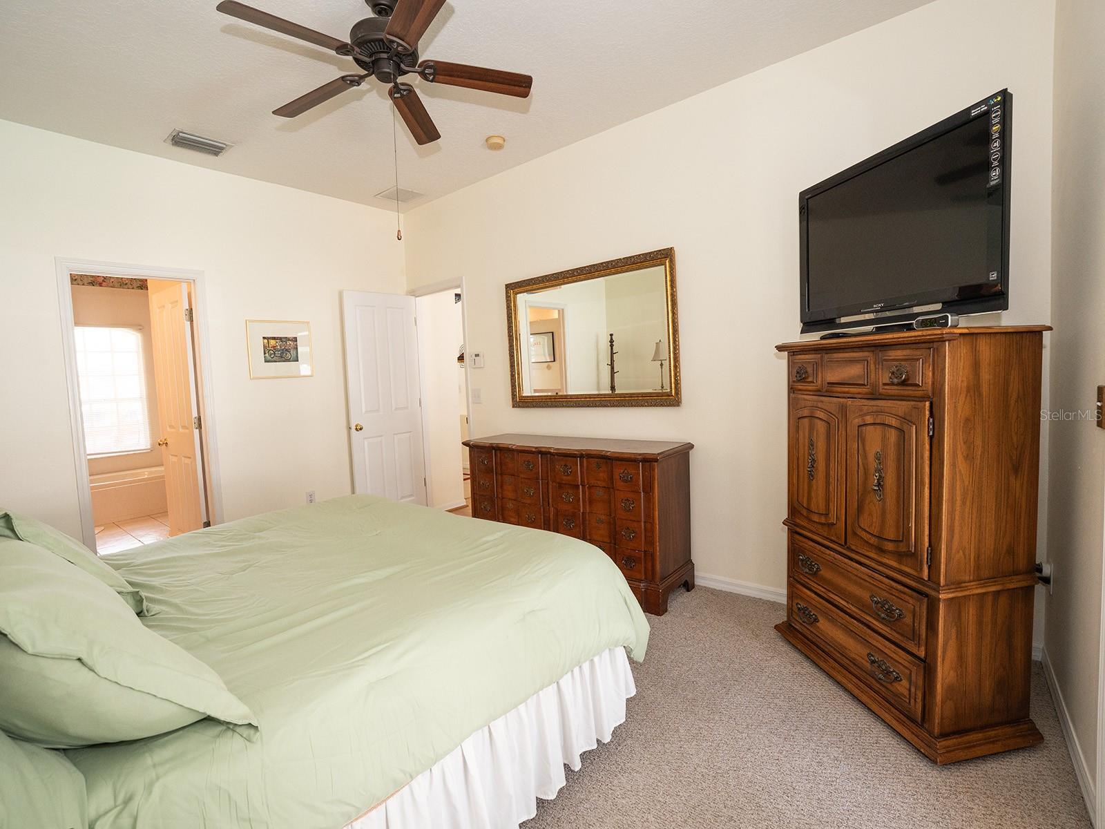 Owner's room includes dresser and mirror