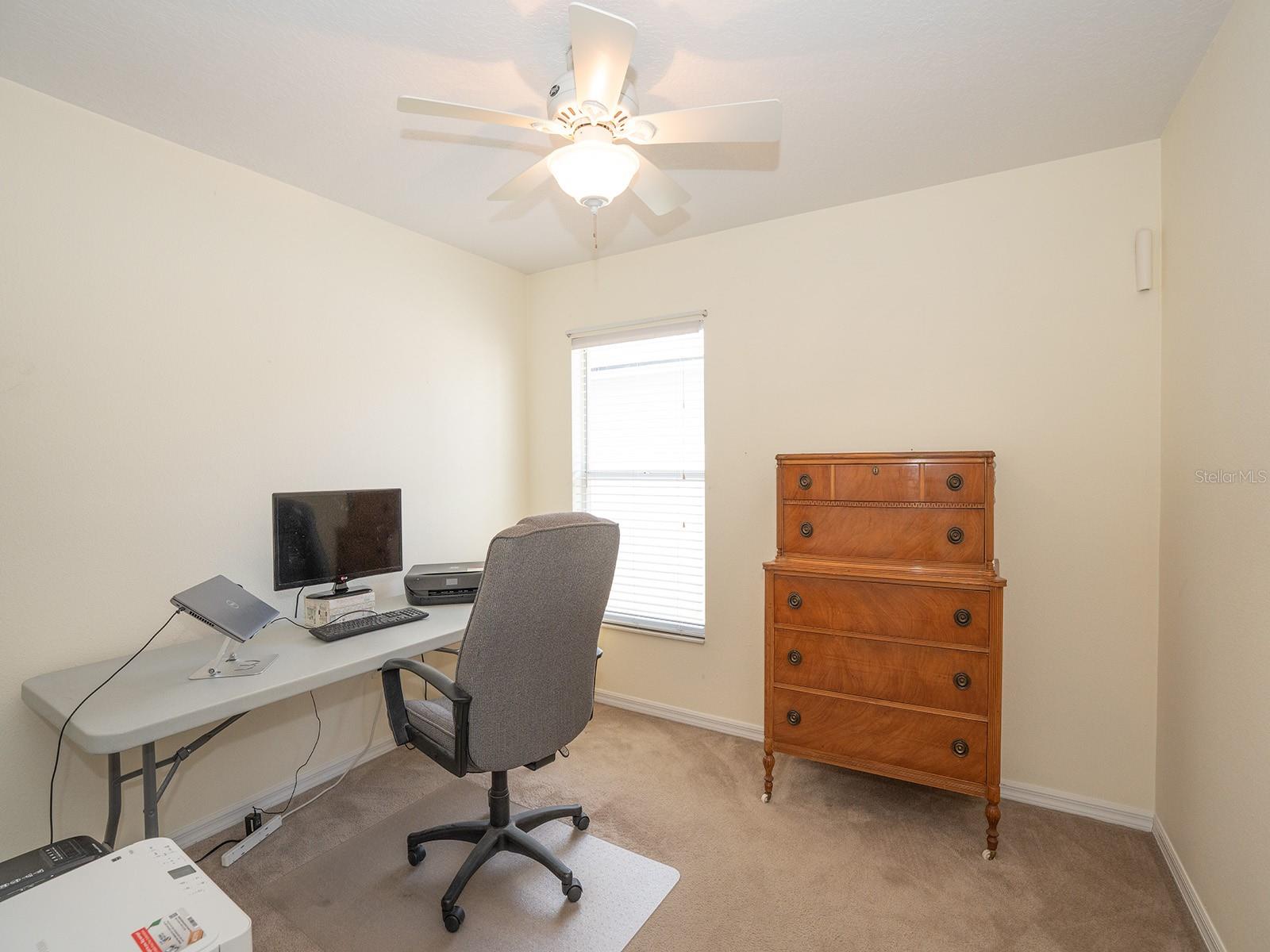 Bedroom #3 includes small printer table and small yellow 4-drawer storage