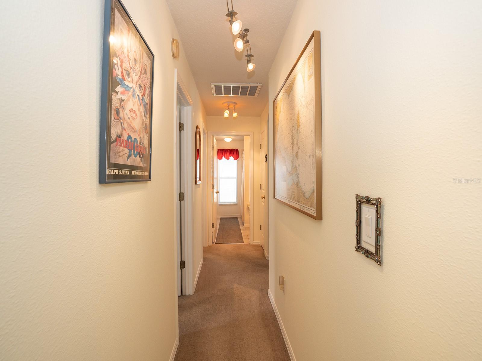 Hallway between 2nd bathroom and other bedrooms