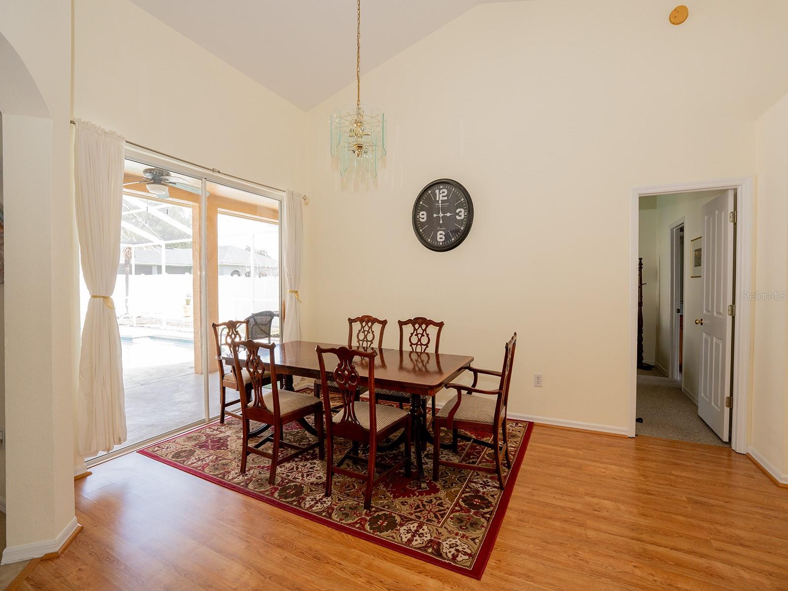 Formal Dining room includes Dining set, rug and clock