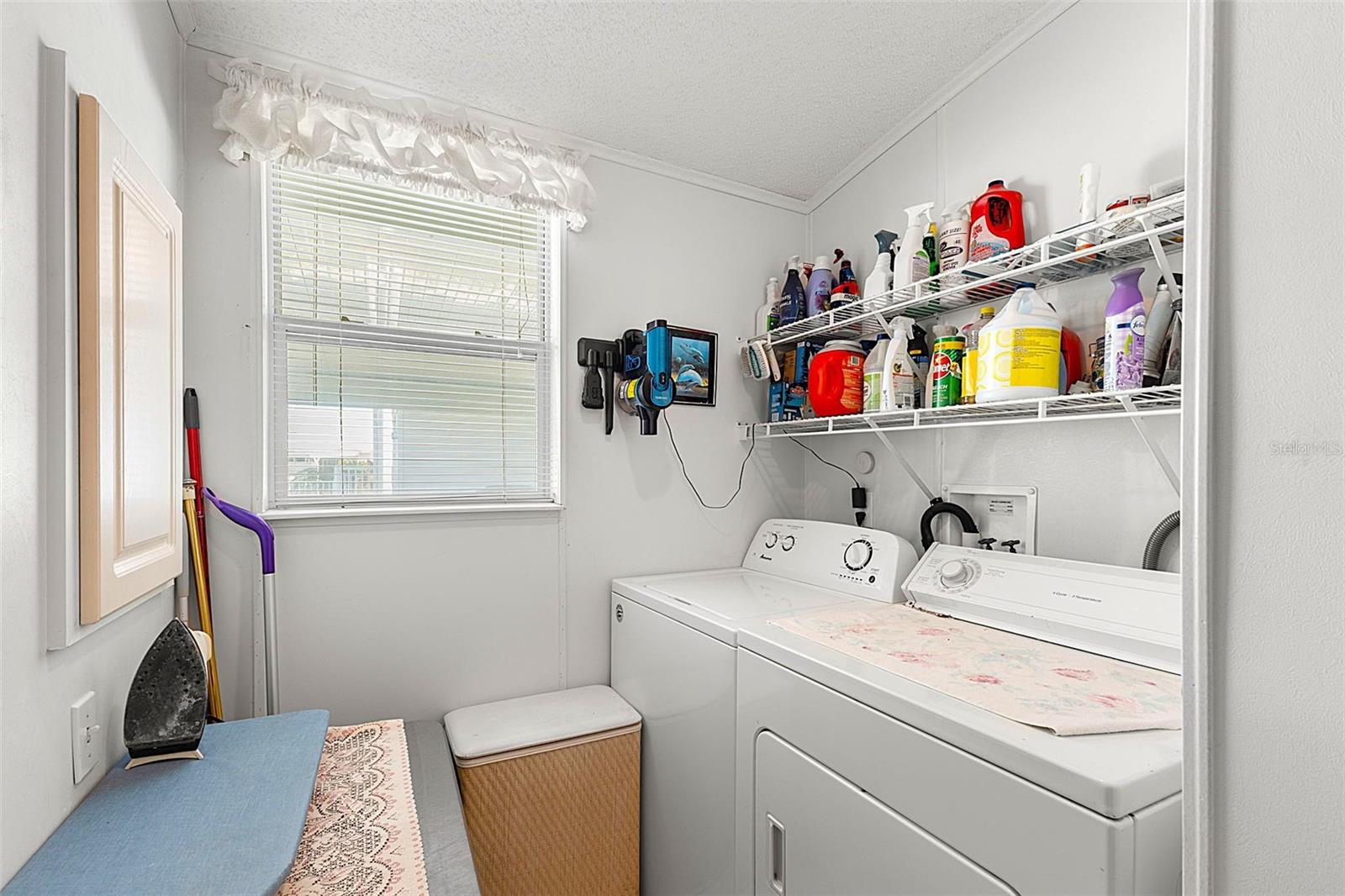Utility room with washer and dryer