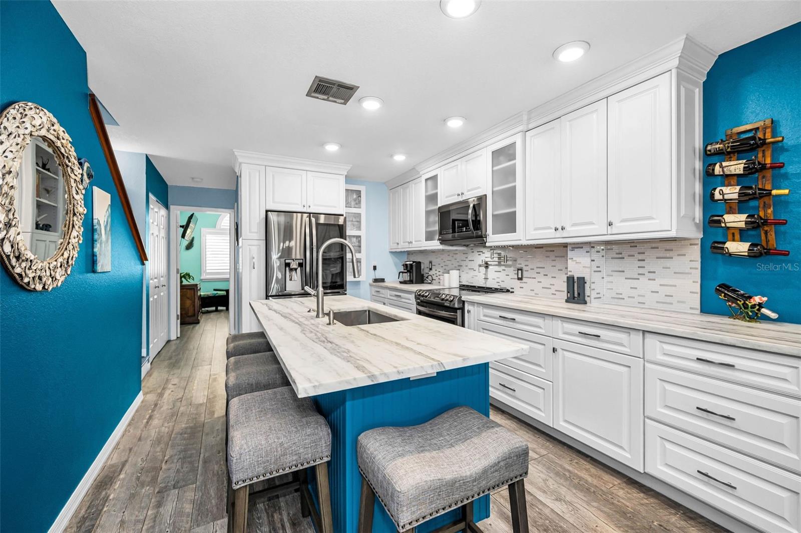 Coastal contemporary kitchen with crisp lines and light, modern finishes