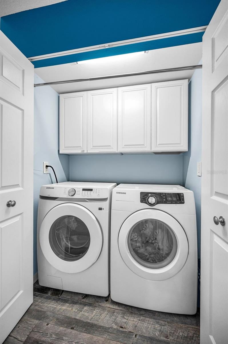Main level Utility closet with full sized washer & dryer