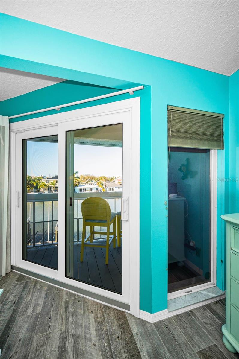 Sliding glass door to the private, Primary bedroom balcony