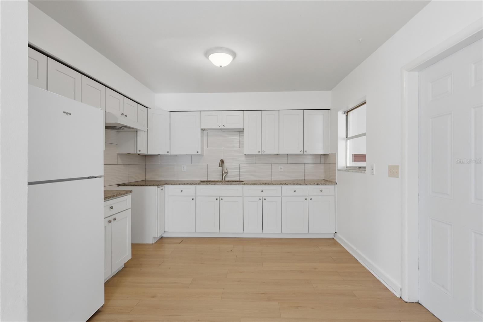Newer soft close kitchen cabinets and drawers and granite counters.
