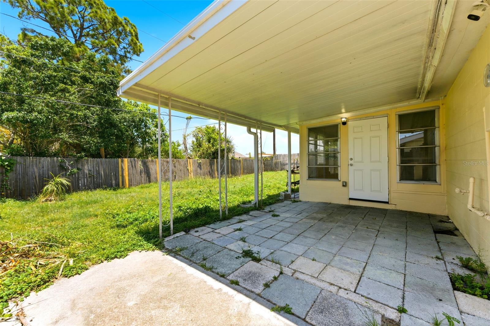 Covered patio in your fully fenced back yard