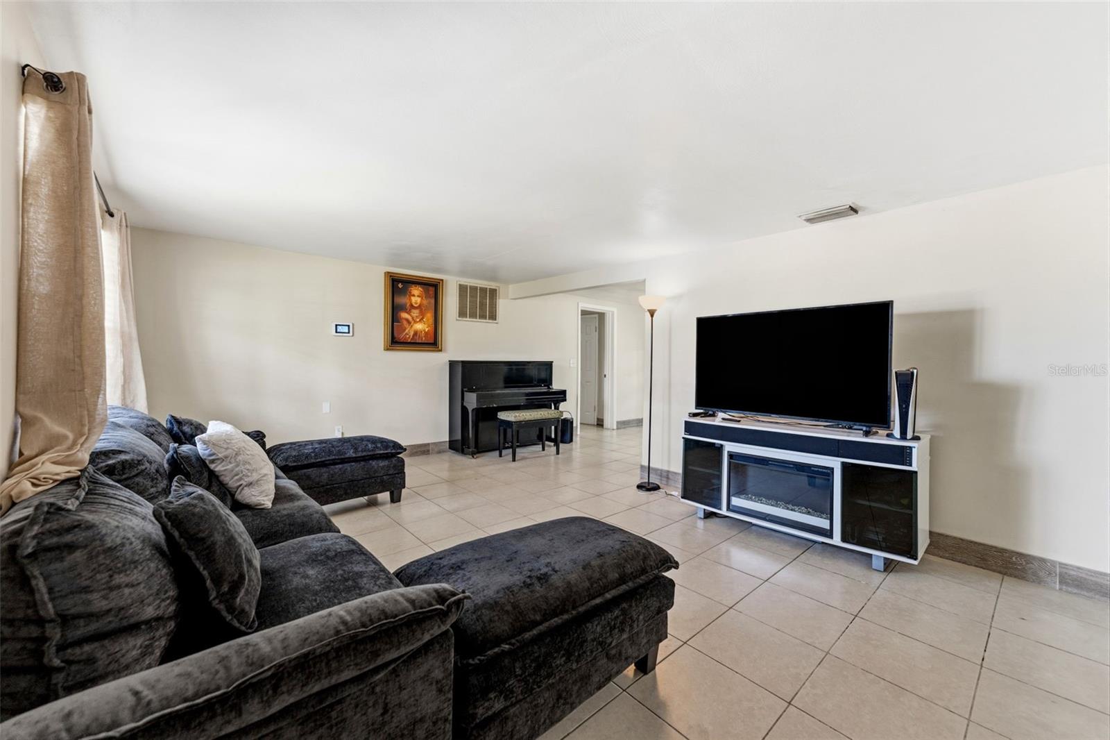Walk in to your open living room with high ceilings througout