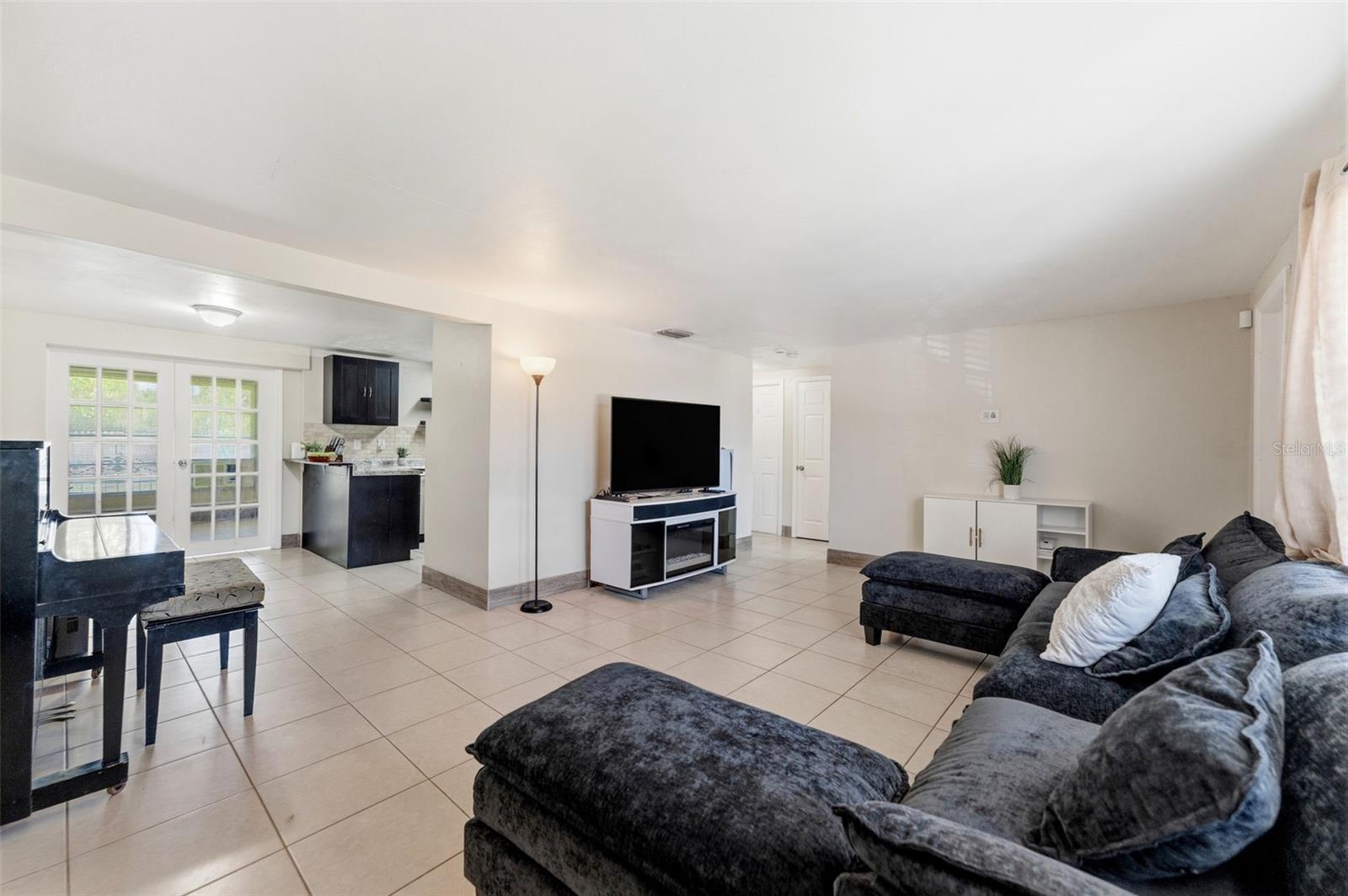 Living room open to the kitchen and dining area