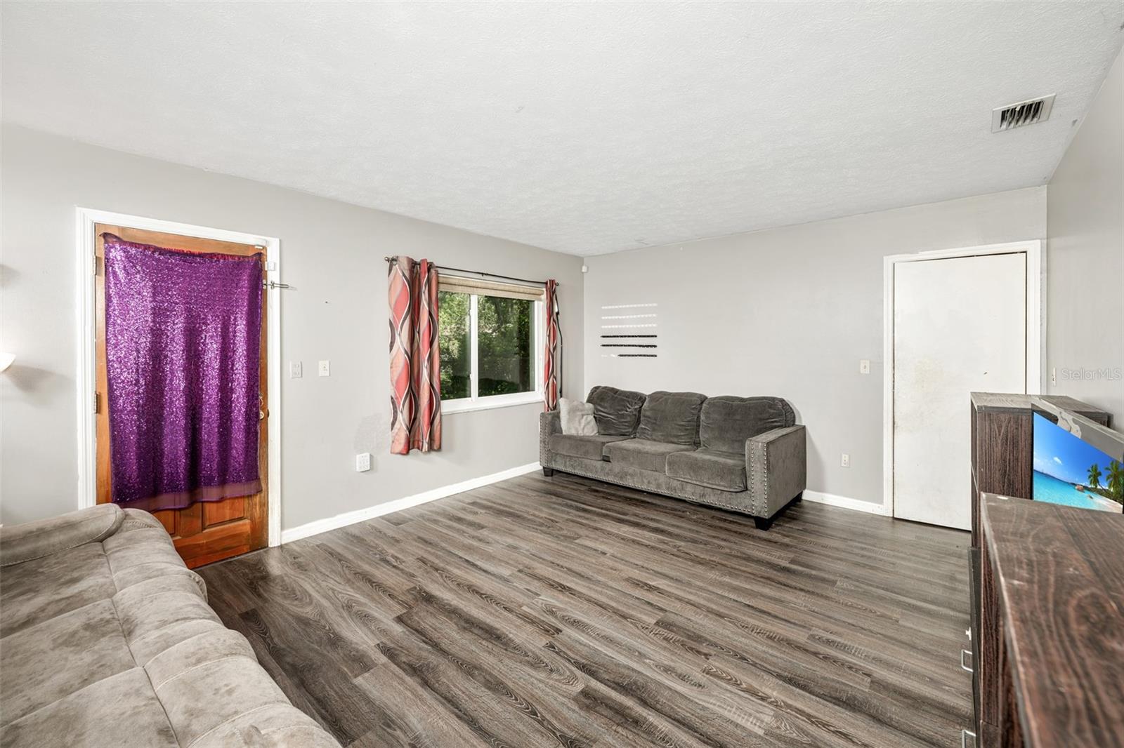 Lower level family room leads to back yard