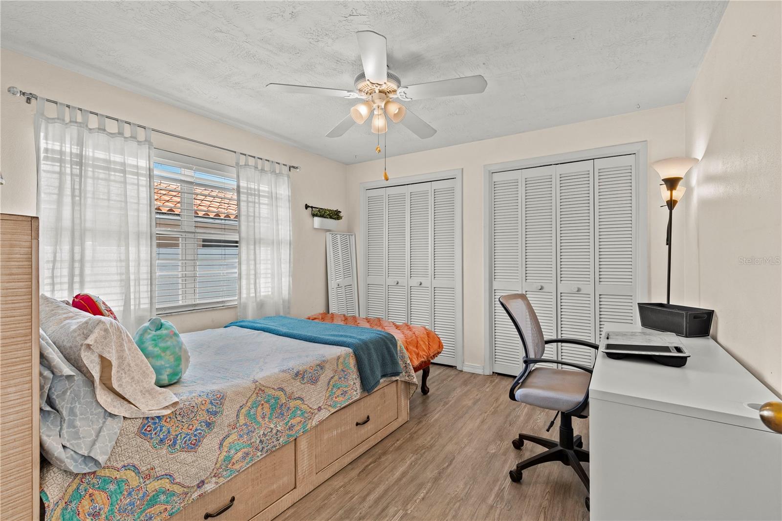 Comfortable and spacious third bedroom featuring ample natural light, generous closet space, and flexibility to accommodate family, guests, or a home office setup.