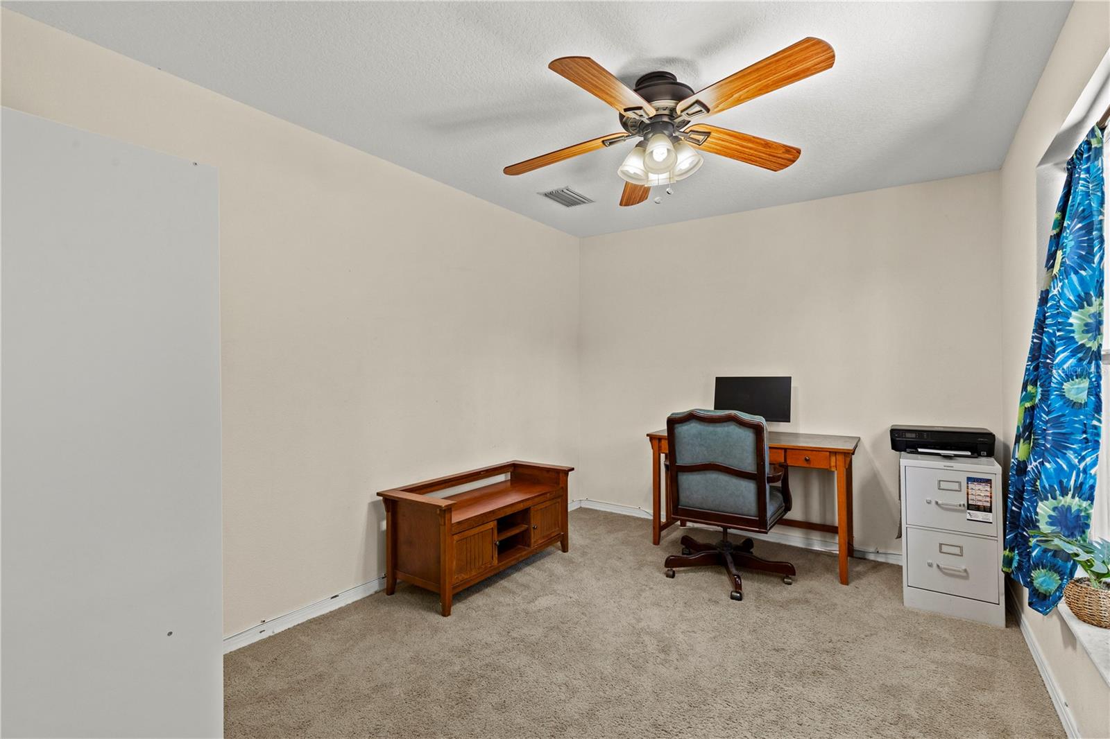 Flexible fourth bedroom offering endless possibilities as a home office, guest room, hobby space, or nursery. Bright and welcoming, this versatile room adapts easily to your lifestyle needs.